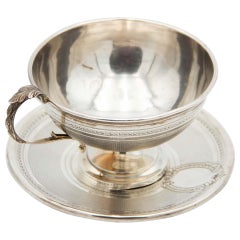 Embossed teacup with guilloche silver saucer, pearl trim and embossed handle