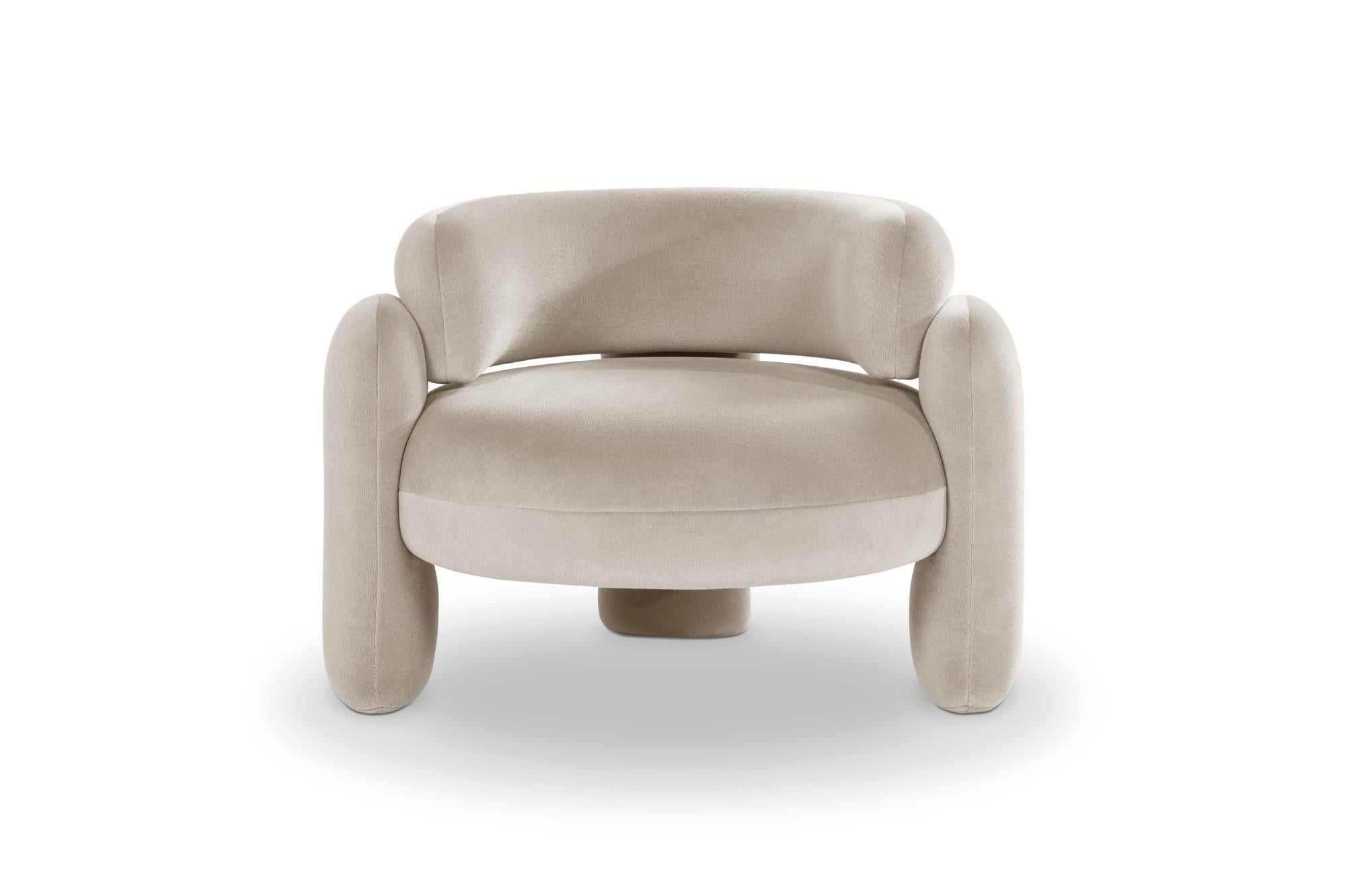 Embrace armchair by Royal Stranger
Dimensions: W 96 x D 85 x H 68 cm.
Different upholstery colors and finishes are available.
Materials: Velvet.

Featuring an enfolding composition of geometrical shapes, the Embrace Armchair will cozy you up in