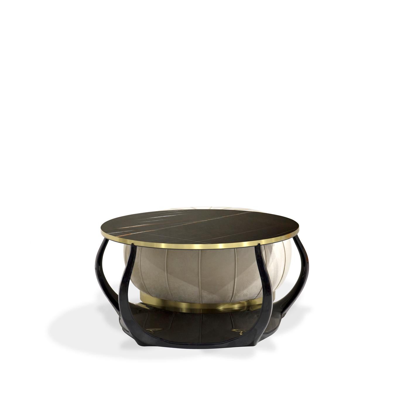 High gloss black lacquered limbs clasp a Sahara Noir marble top and a seamed round upholstered ottoman with a polished brass base to compose the intriguing Embrace cocktail table ottoman combo.