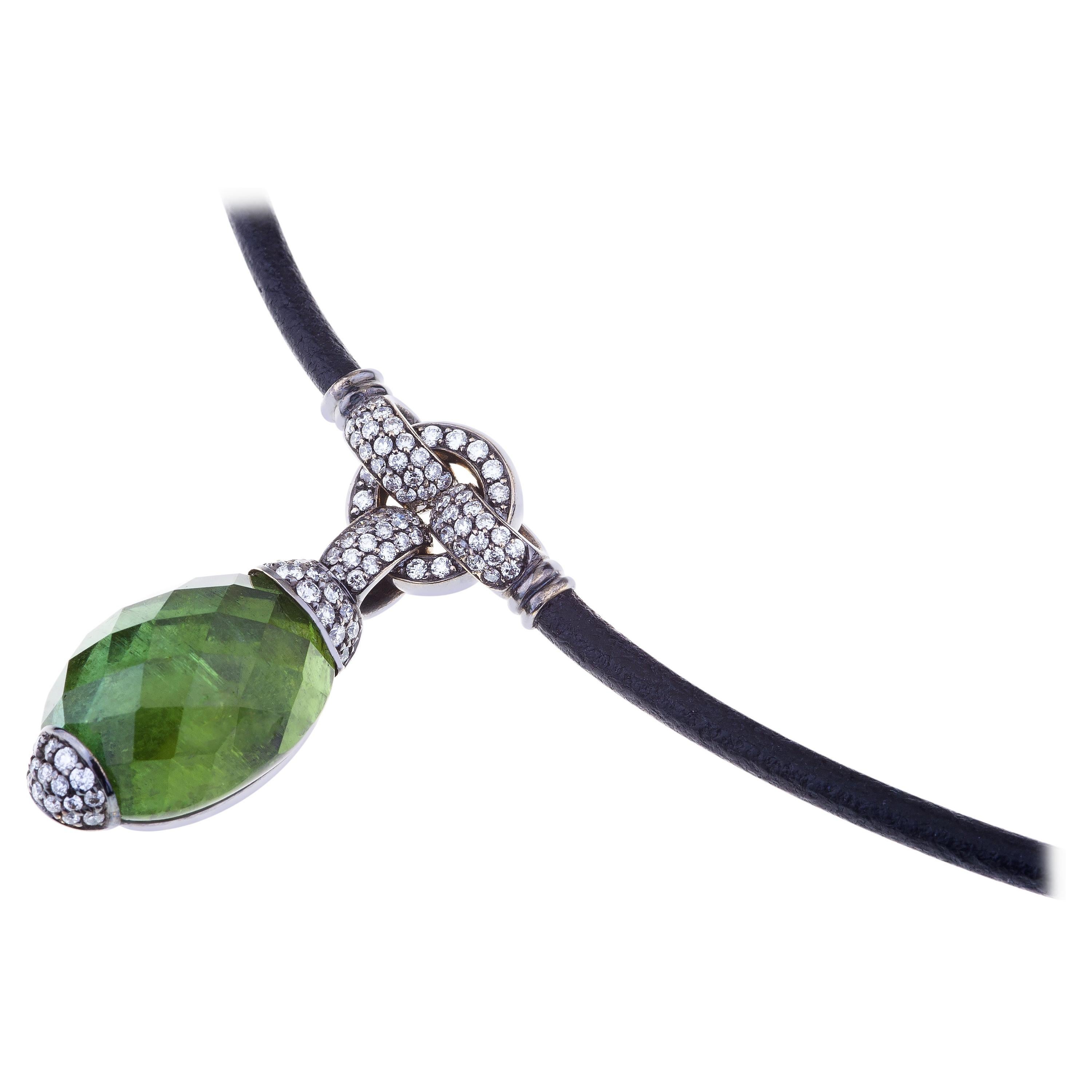 Embrace Collection by Angeletti. Pendant with Faceted Green Tourmaline, Diamonds and Gold.
Stone From an Exceptional Tourmaline of around ct. 200 Cut and Faceted by Expert Hands. Wholly Natural, No treatment at all. The Green Tourmaline is ct.