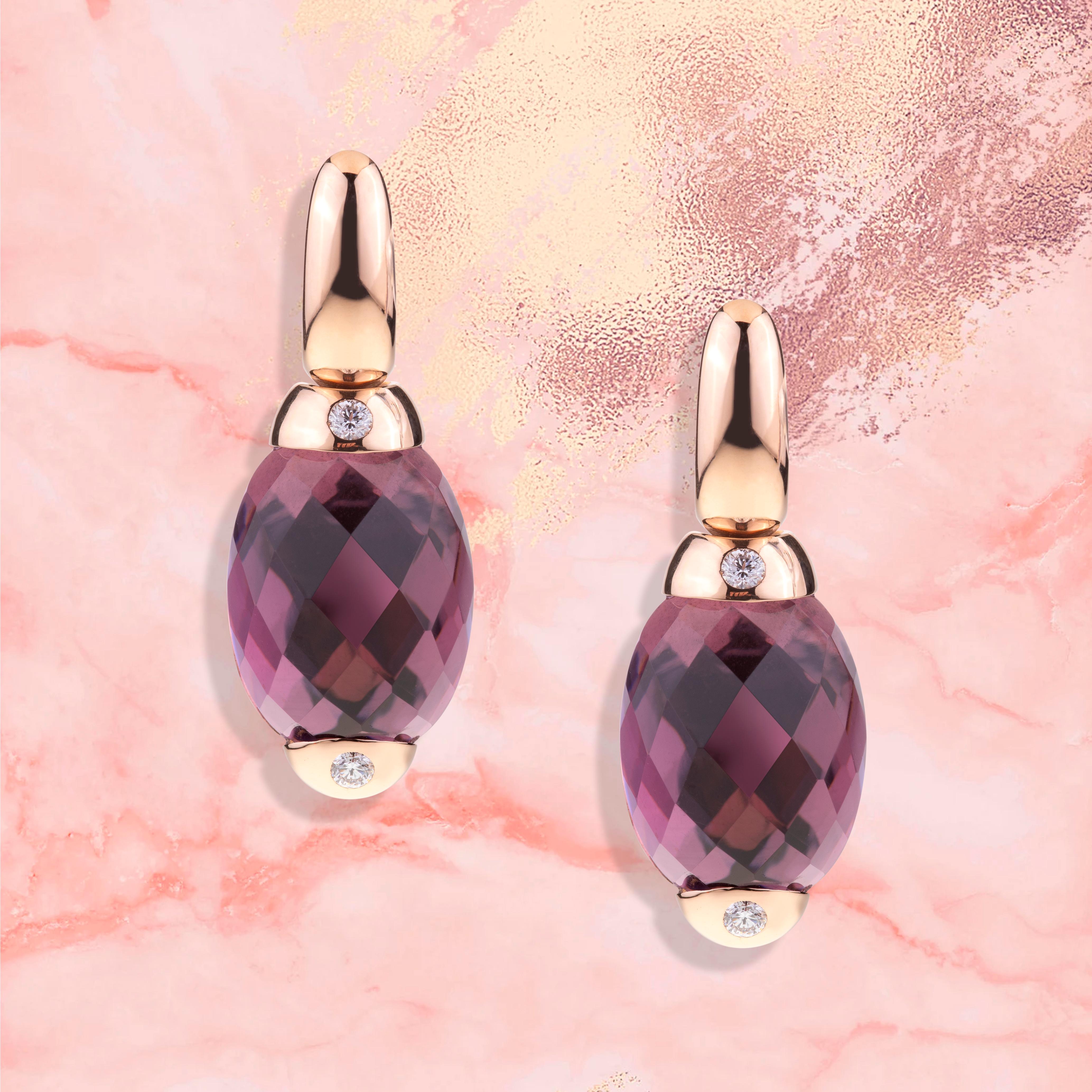 Embrace Collection by Angeletti. Rose Gold Earrings With Amethyst and Diamonds.
Iconic Embrace Model, Designed and Manifactured in Rome.
Four diamonds (ct. 0.32) are set on each side of the main stone, the purple Amethyst (ct.29.03). The weight of