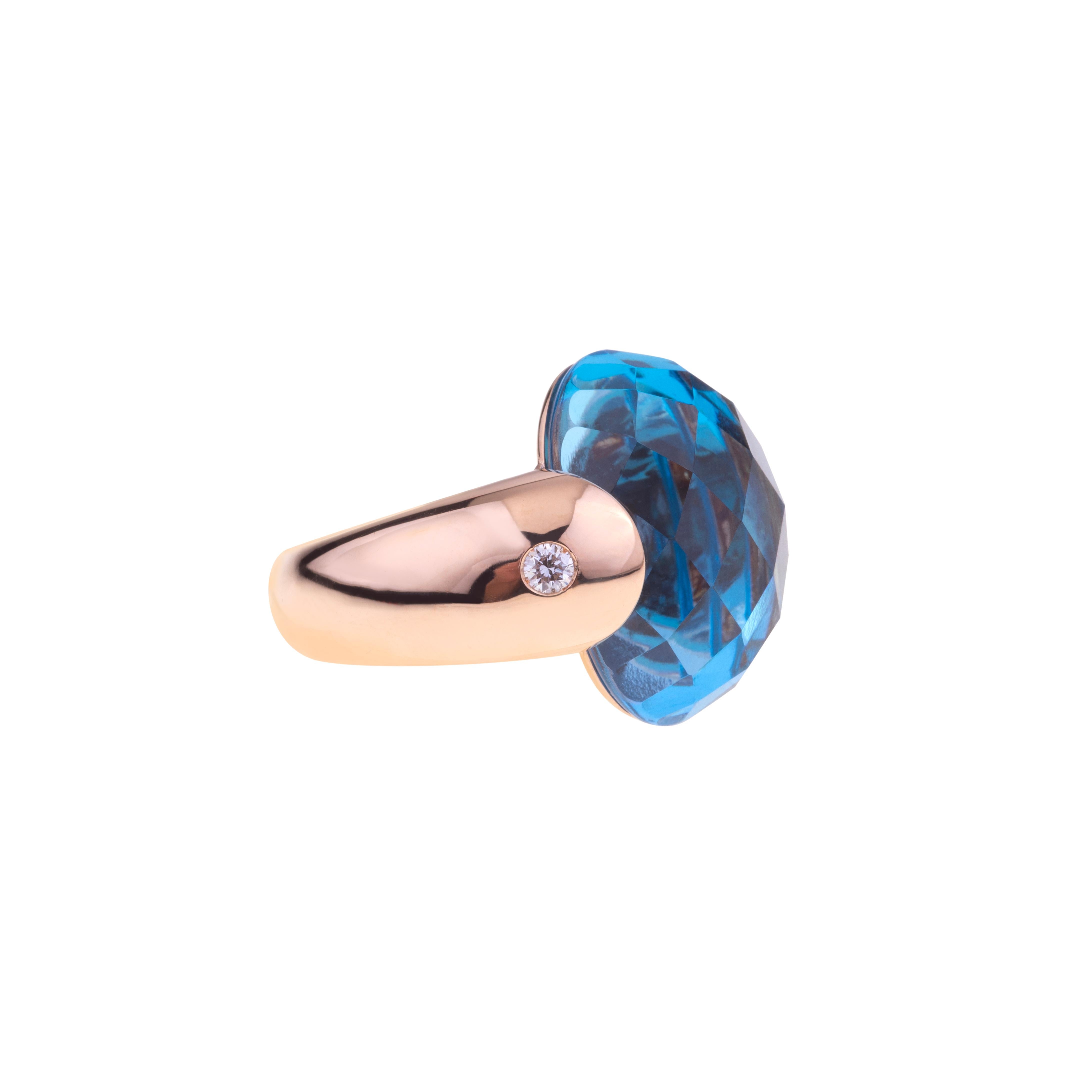 Embrace Collection by Angeletti. Rose Gold Ring With Blue Topaz and Diamonds.
Iconic Embrace Model, Designed and Manifactured in Rome.
On the side of the Blue Topaz (ct.18.06), two diamonds  ct. 0.16. Gold Weight is Around 8 to 11 gr. depending on