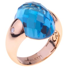 Embrace Collection by Angeletti. Rose Gold Ring With Blue Topaz and Diamonds