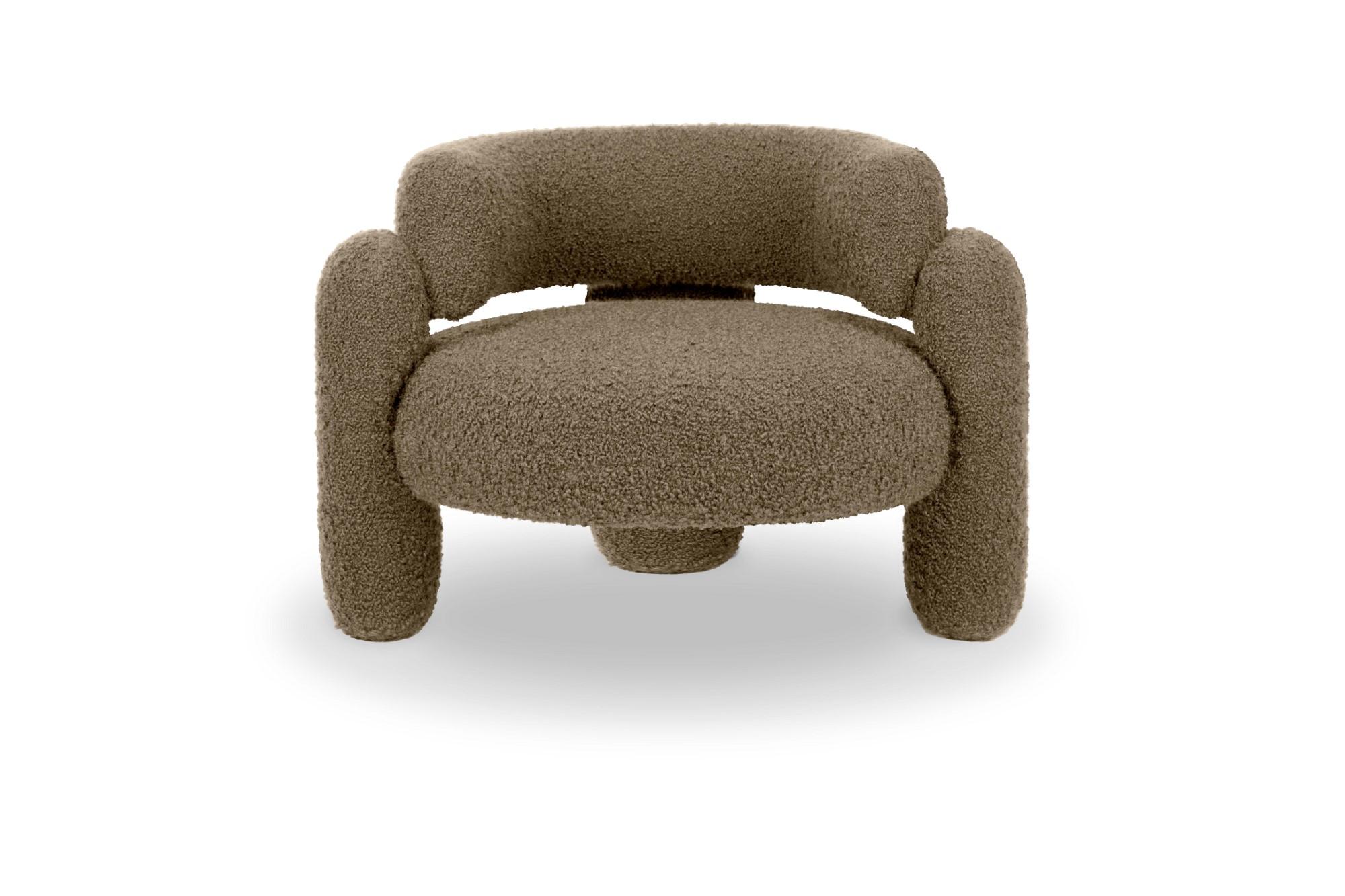 Embrace Cormo natural armchair by Royal Stranger
Dimensions: W 96 x D 85 x H 68 cm.
Different upholstery colors and finishes are available.
Materials: Upholstery.

Featuring an enfolding composition of geometrical shapes, the Embrace armchair