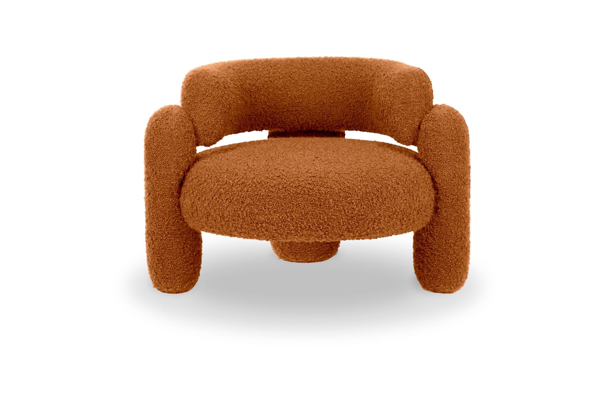Embrace Cormo Persimmon armchair by Royal Stranger
Dimensions: W 96 x D 85 x H 68 cm.
Different upholstery colors and finishes are available.
Materials: Upholstery.

Featuring an enfolding composition of geometrical shapes, the Embrace Armchair will