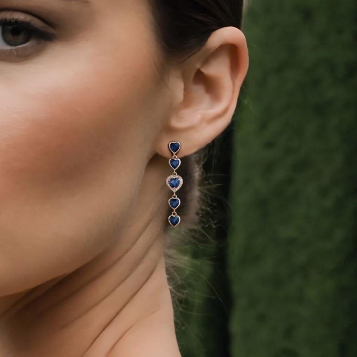 The Embrace Diamond 14K Yellow Gold Drop Earrings are a stunning blend of luxury and color. Crafted in 14K yellow gold, these earrings feature a captivating mix of natural diamonds, blue sapphires, pink sapphires, and emeralds. With 0.07CT of