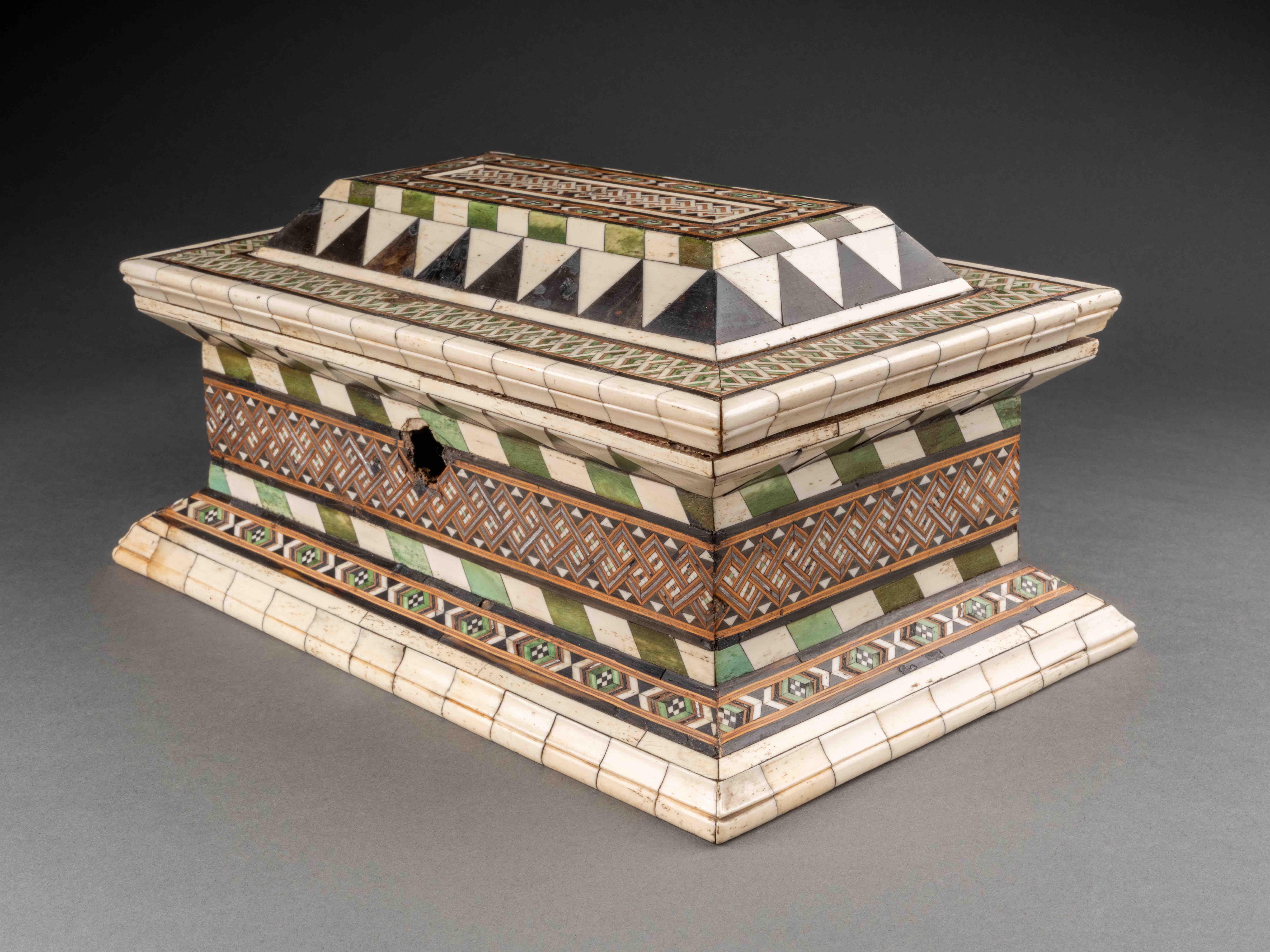 Embriachi workshop marquetry casket
Northern Italy, 15th century
Alla certosina inlays (bone, stained bone, pewter and wood)
H 28.2 x W 18 x D 14 cm

This beautiful casket of rectangular form is richly decorated with the characteristic geometric