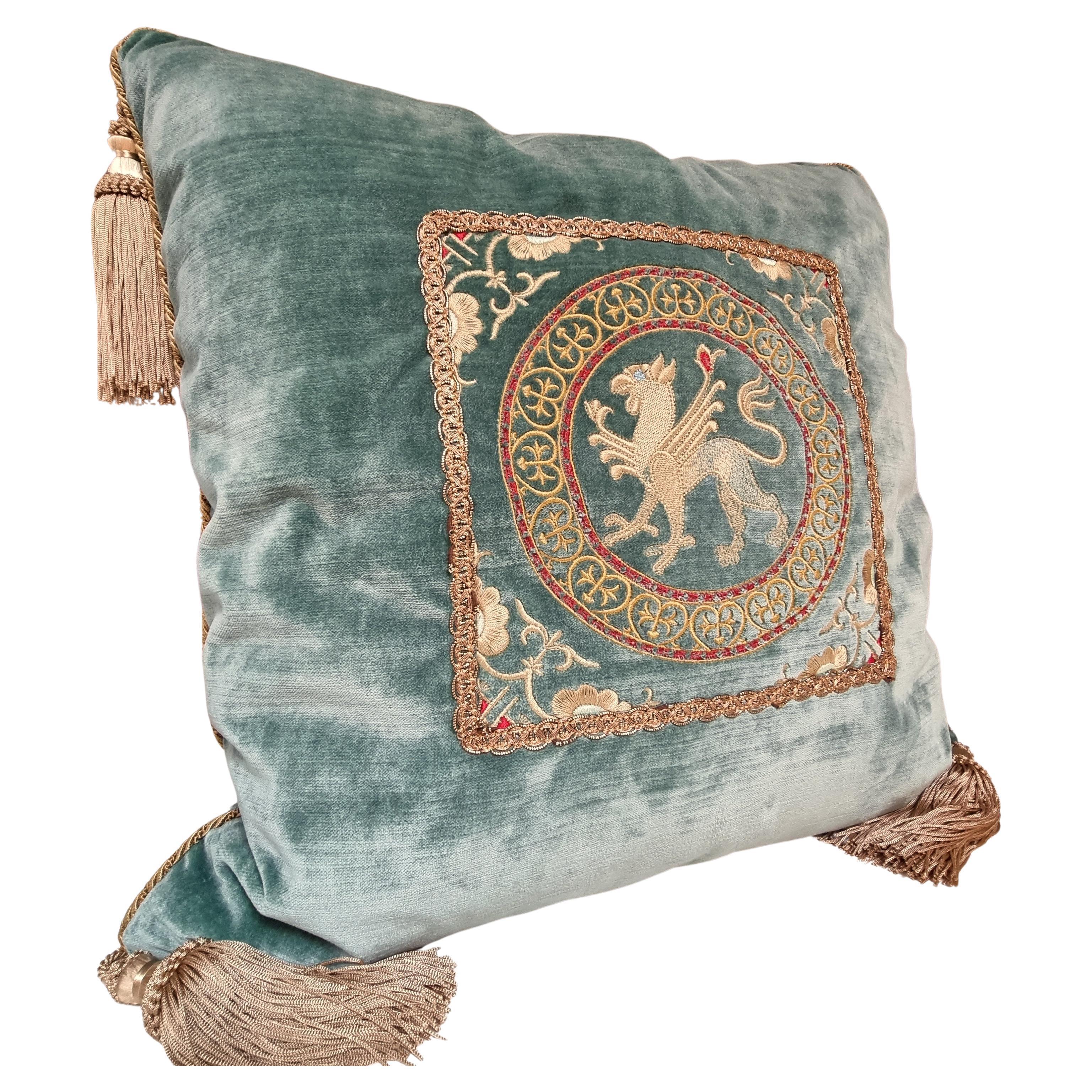 This amazing decorative pillow with beige tassel at the four corners is handmade using Rubelli  velvet in aqua color on both sides finished with Houlès  twisted lip cord, embellished with precious embroideries (13th-century design) framed with flat