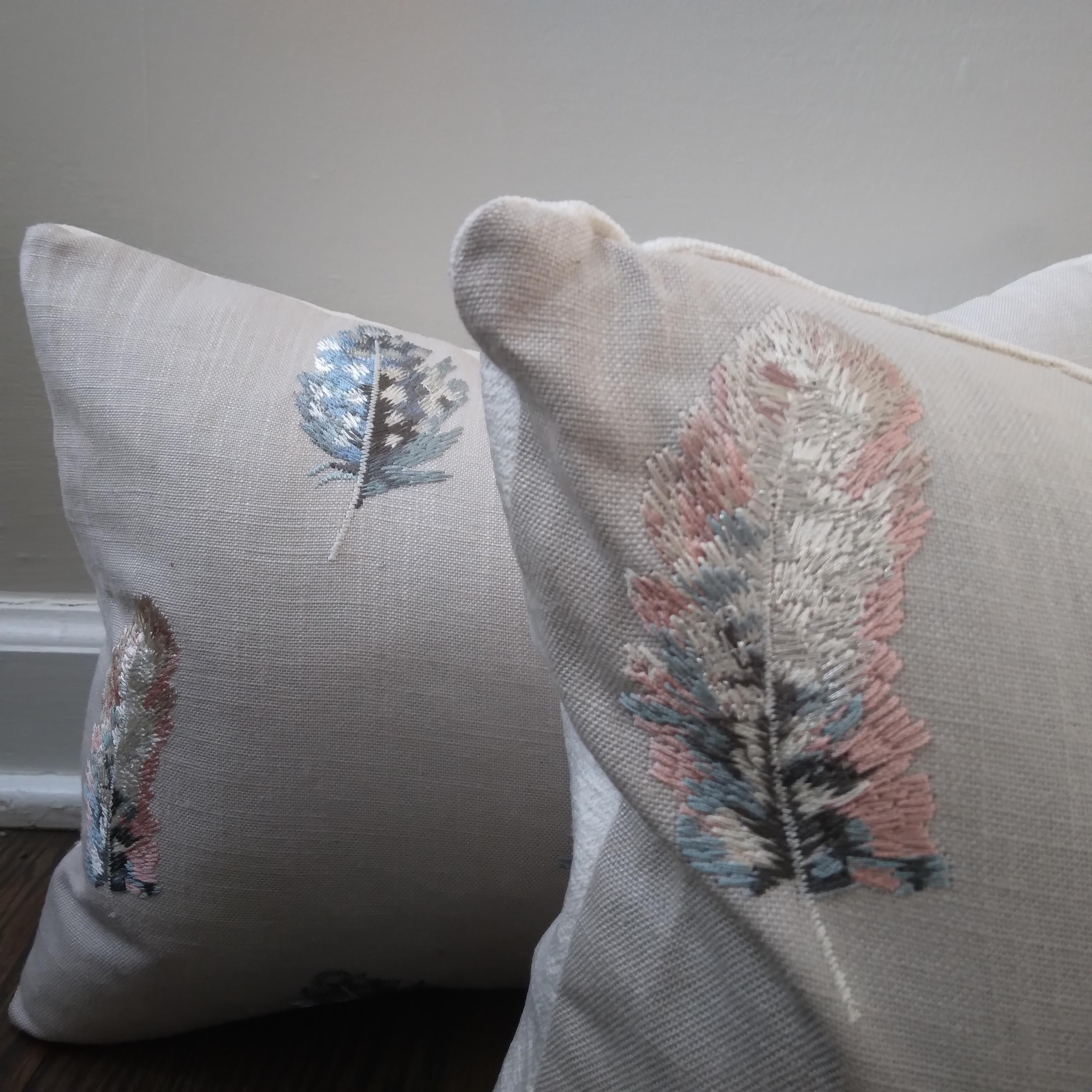 Delicate plumes of light -- Animalia-inspired pillows are the perfect way to add soothing color and playful design to your living space. The pastel pink and blue, light-catching embroidery looks fantastic against a lineny background. We love the