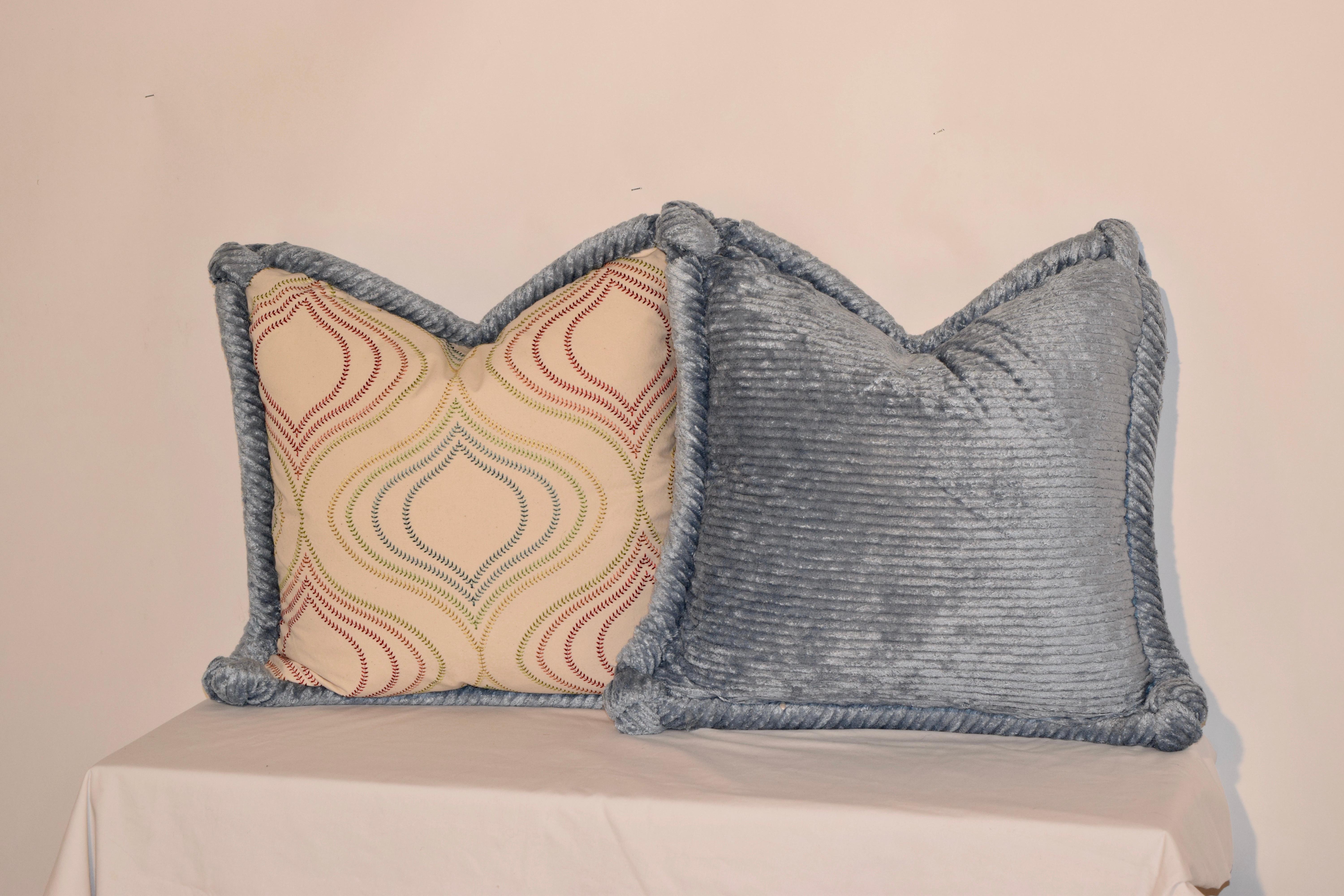 Limited edition design pillows which is handmade in North Carolina. All USA materials. The pillow has an embroidered cotton front panel and a light blue chenille back panel with hand sewn rope welt. Wonderfully designed with hidden zippers and the