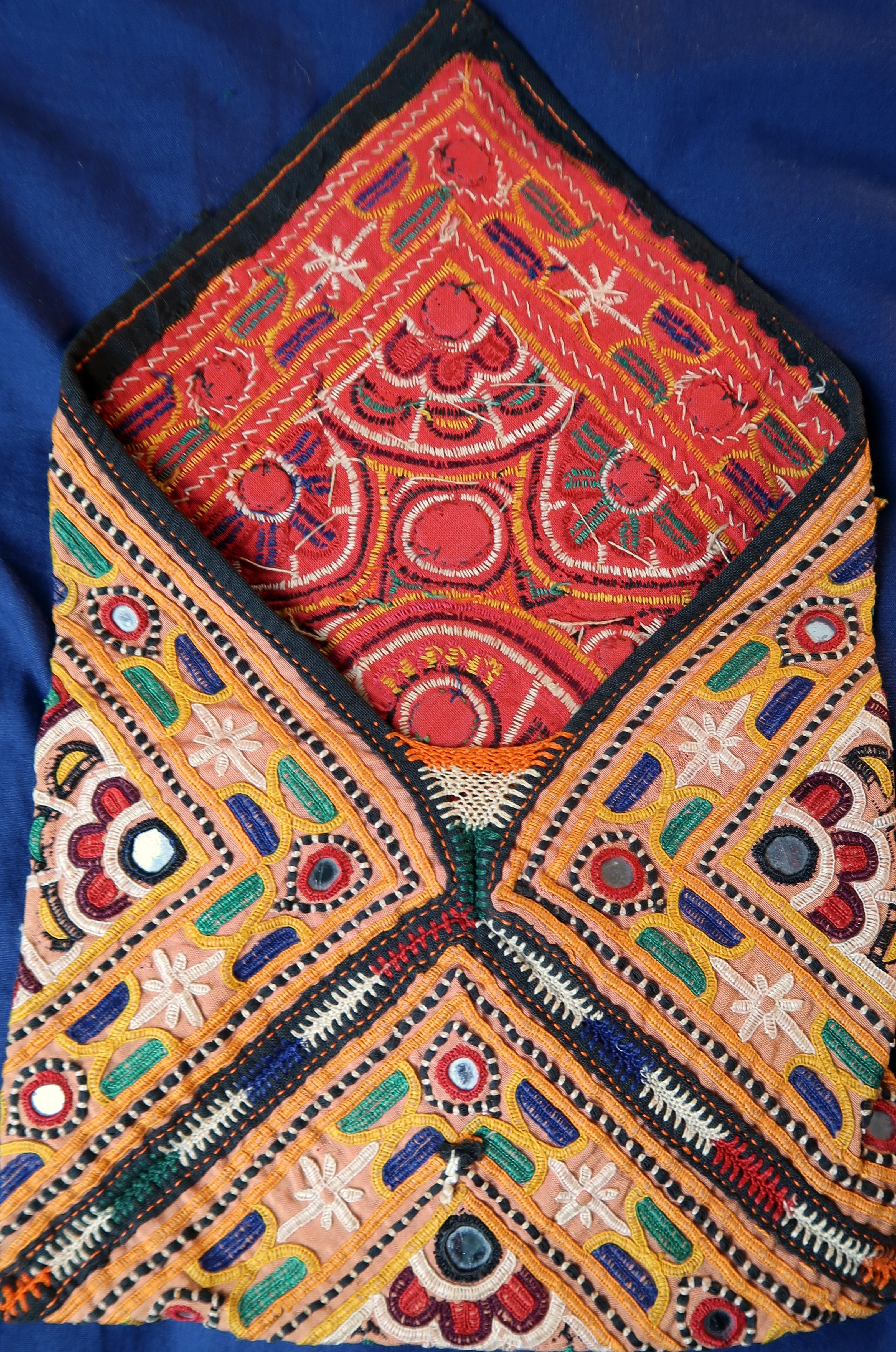 Pretty embroidered -envelope shape Purse from Kutch, Gujarat, India. 

Circa 1970

Measures: 22cm x 17cm.

