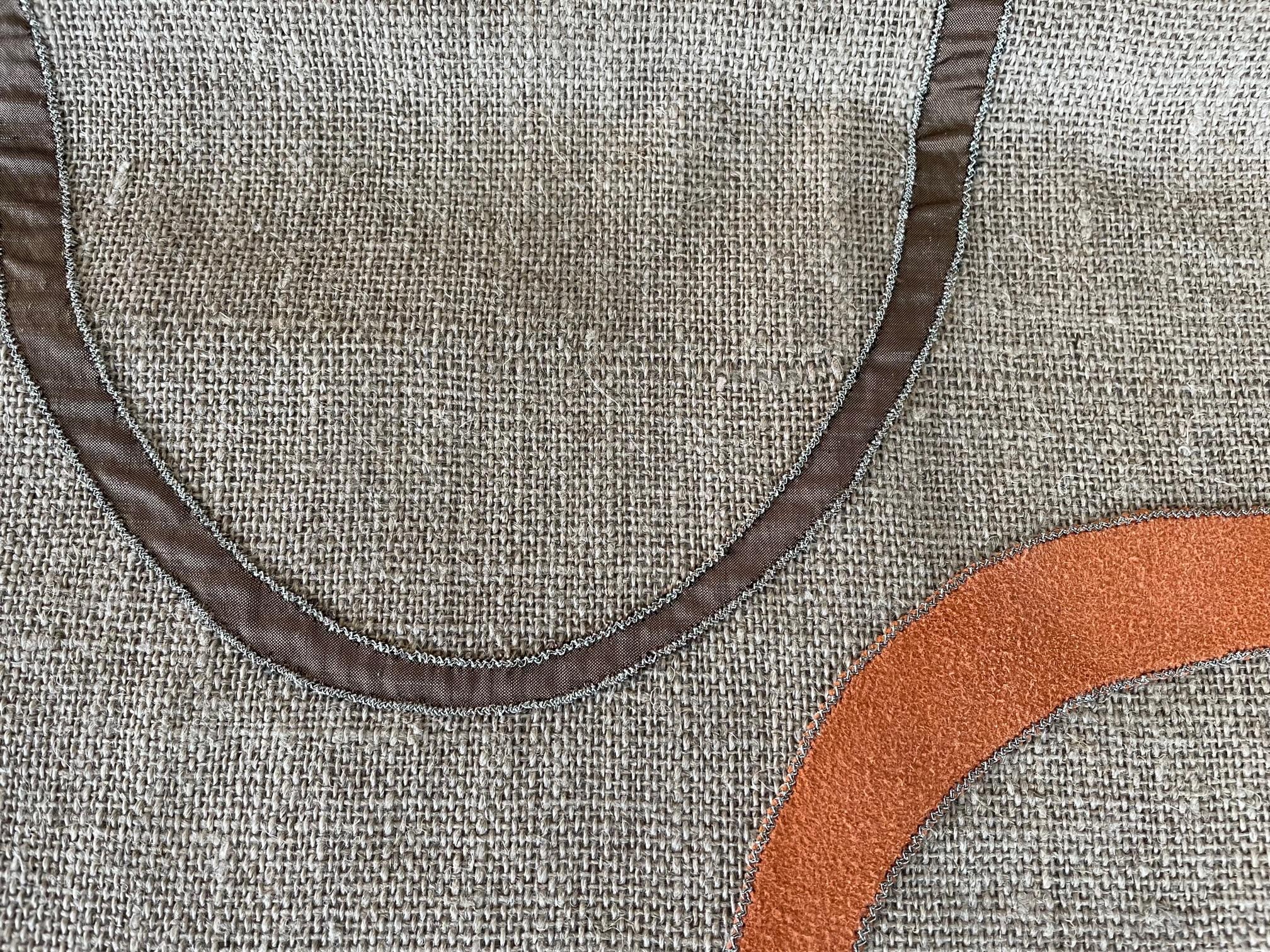 Hemp panel col. Beige : the appliqué work has been made all by hand, the contemporary design is made with silk col. Beige and brown and suede leather col. Orange, outline stitch ant. Silver,

This panel can be turned in to cushions or a
