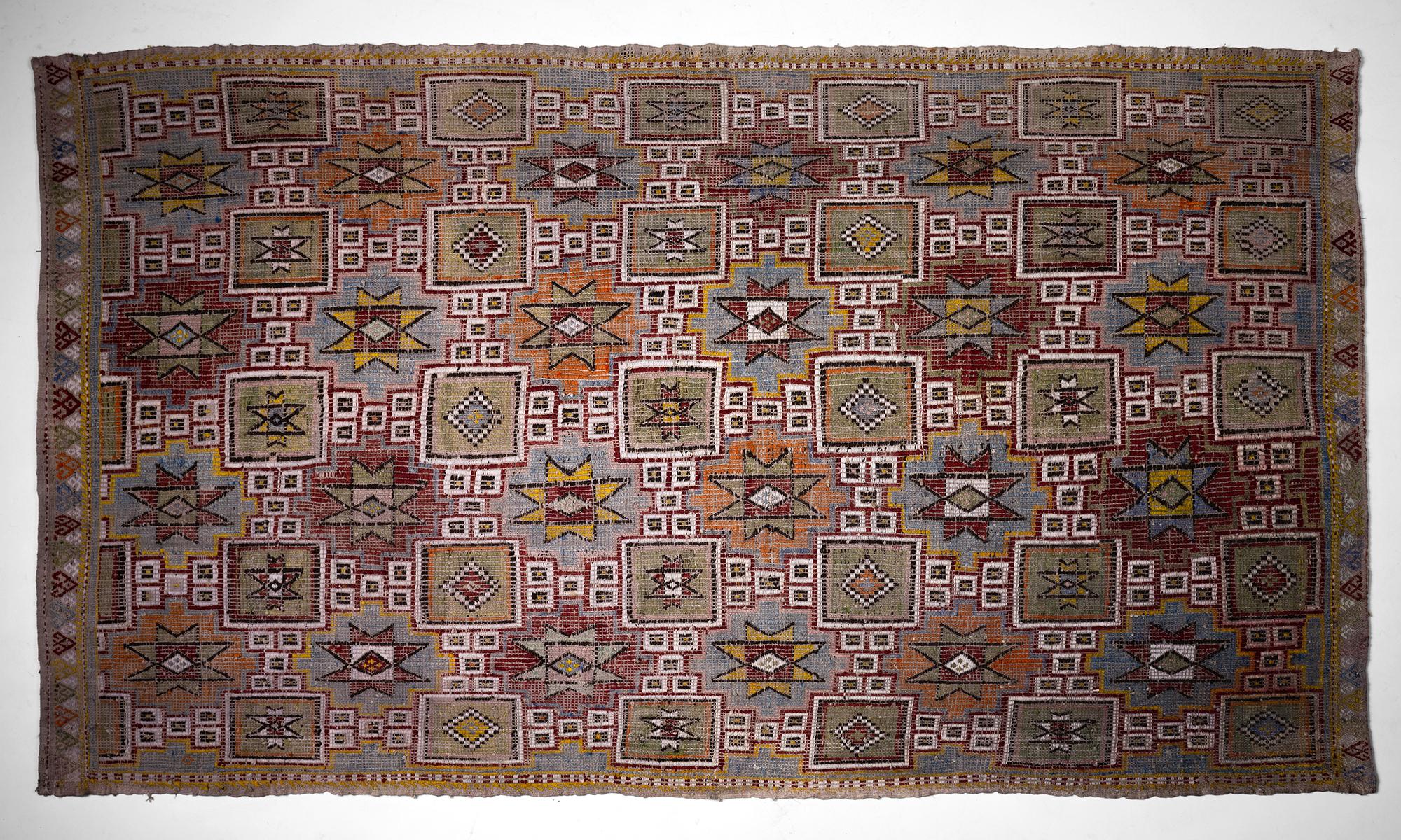 Embroidered Kilim

Turkey 1950

Hand loomed flat weave rug with cicim embroidered design motif. Made from hand spun sheets wool with vegetable dyes from the Konya area of central Turkey.

Measures: 107” x 63”.