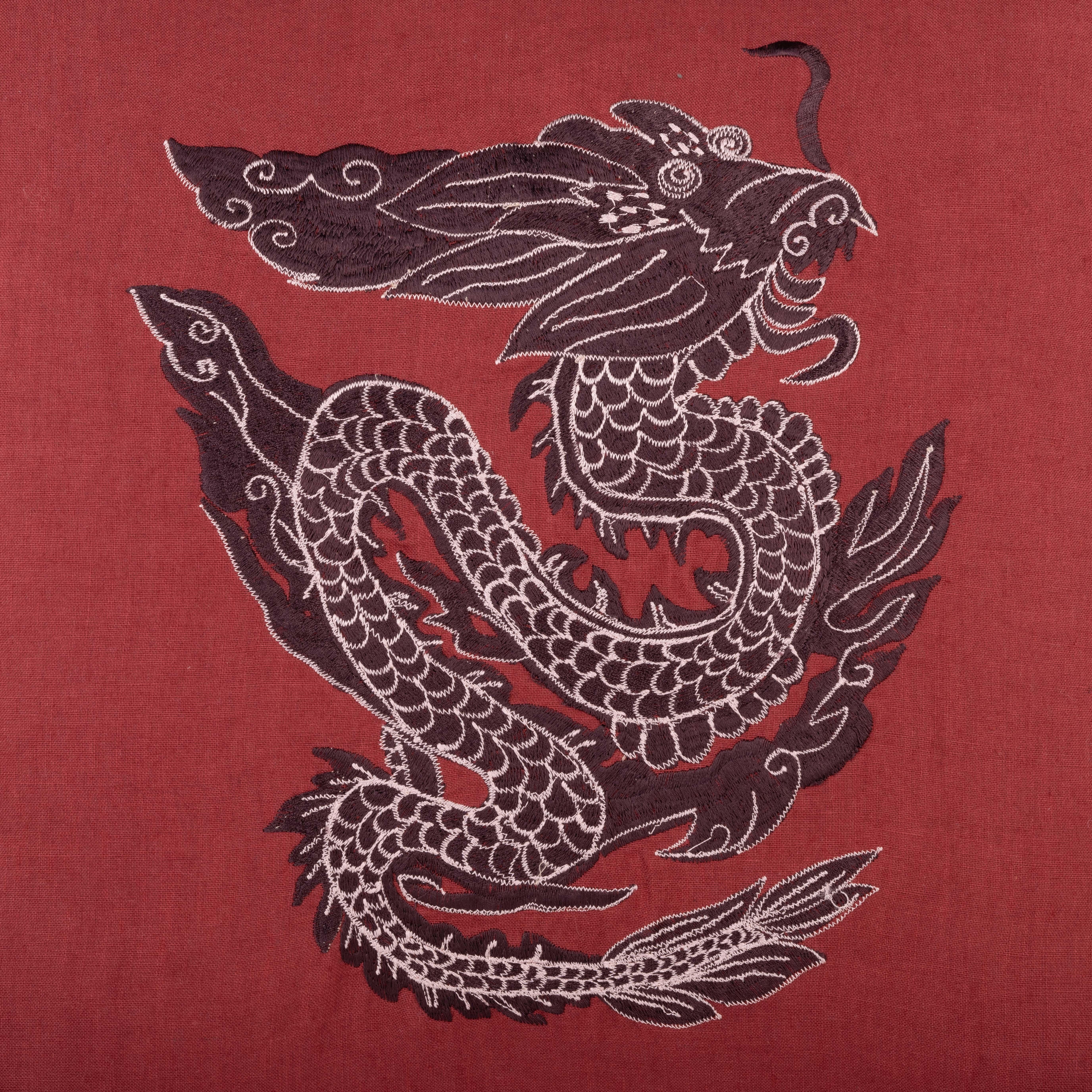 This cushion is a striking accent piece, featuring a fully embroidered dragon on a linen base, with playful tassels at each corner. Perfect for adding texture and personality to your living room, bedroom, or lounge.

Cushion insert not included. 