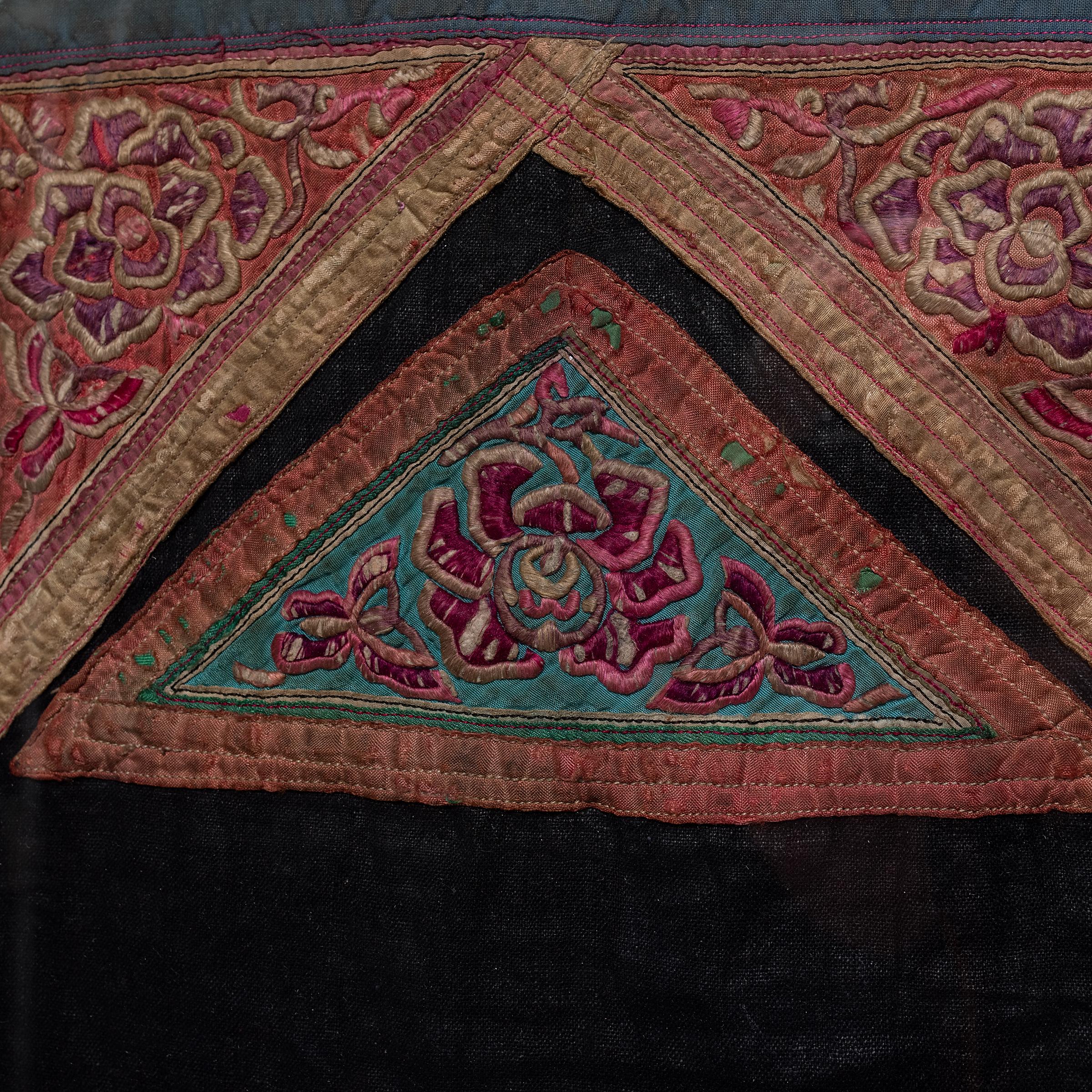 The connection between love and embroidery is nowhere stronger than among the minority peoples of China. Hand-stitched by a mother herself or gifted by the women in her family, the baby carrier not only kept the baby close, it acted as a visual