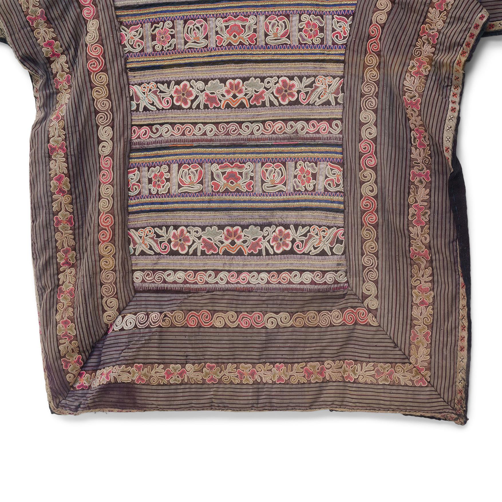 The connection between love and embroidery is nowhere stronger than among the minority peoples of China. Hand-stitched by a mother herself or gifted by the women in her family, the traditional fabric baby carrier not only keeps the baby close, it