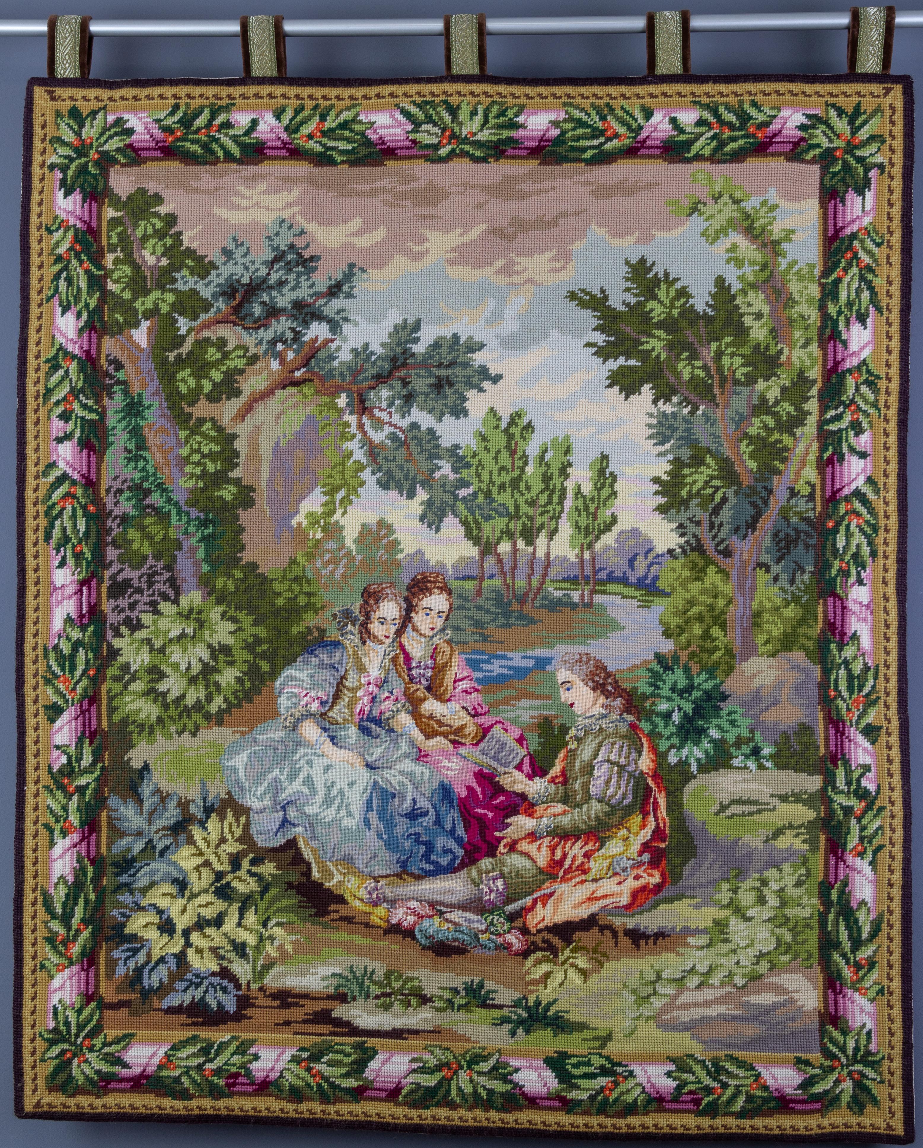 This beautiful and colorful embroidered wall hanging or a tapestry from the 1970s depicts a gentleman and two ladies reading a book.
Dimensions: height 103 cm / 4055 in (with loops), 97 cm / 3818 in (without loops); width 82 cm / 3228 in; depth 05