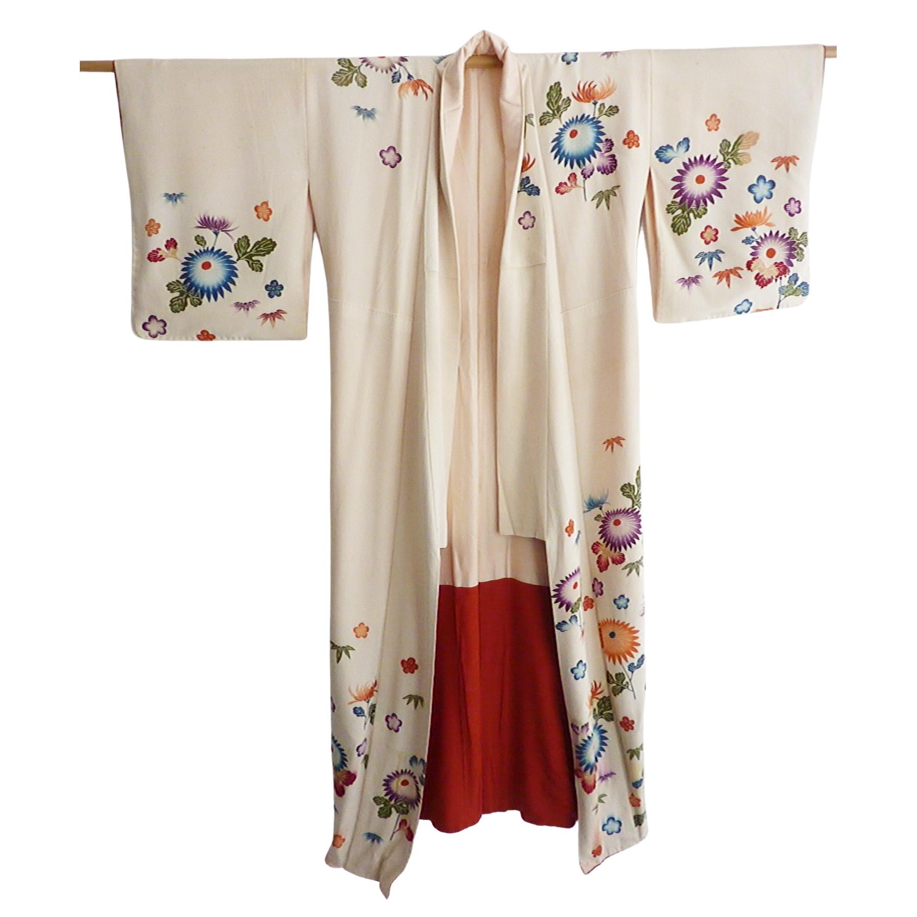 Gorgeous luxurious pure silk kimono.
Lined in silk with dramatic crimson red bottom lining. 
Circa: 1920-1930
Place of Origin: Japan
Material: Silk Condition: Good/fair 
Color: Rich vanilla ecru color background with handpainted floral.
Some age
