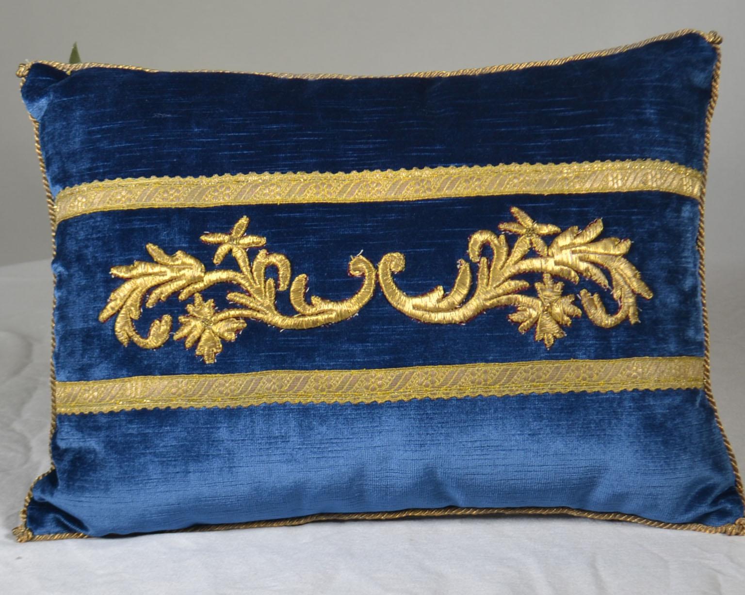 Antique Ottoman Empire raised gold metallic embroidery bordered with gold metallic on midnight blue velvet. Hand trimmed with vintage gold metallic cording knotted in the corners. Down filled. Size: 11