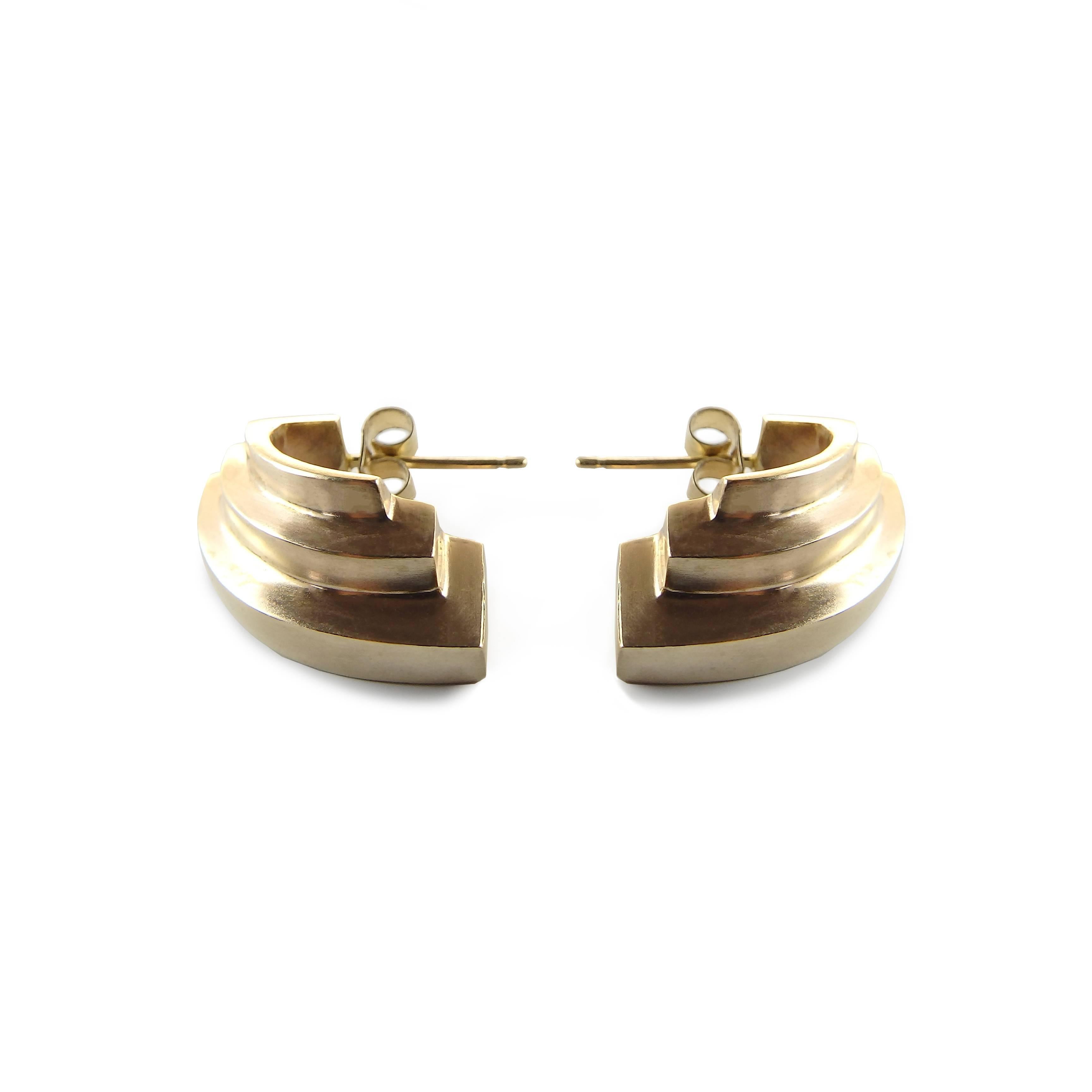 A uniquely sculptural brand, Emer Roberts Design 18 carat gold earrings reflect a streamlined and classic style. Bold, edgy and elegant, the architectural and art deco inspired earrings are contemporary and distinctly angular.

Designed and created