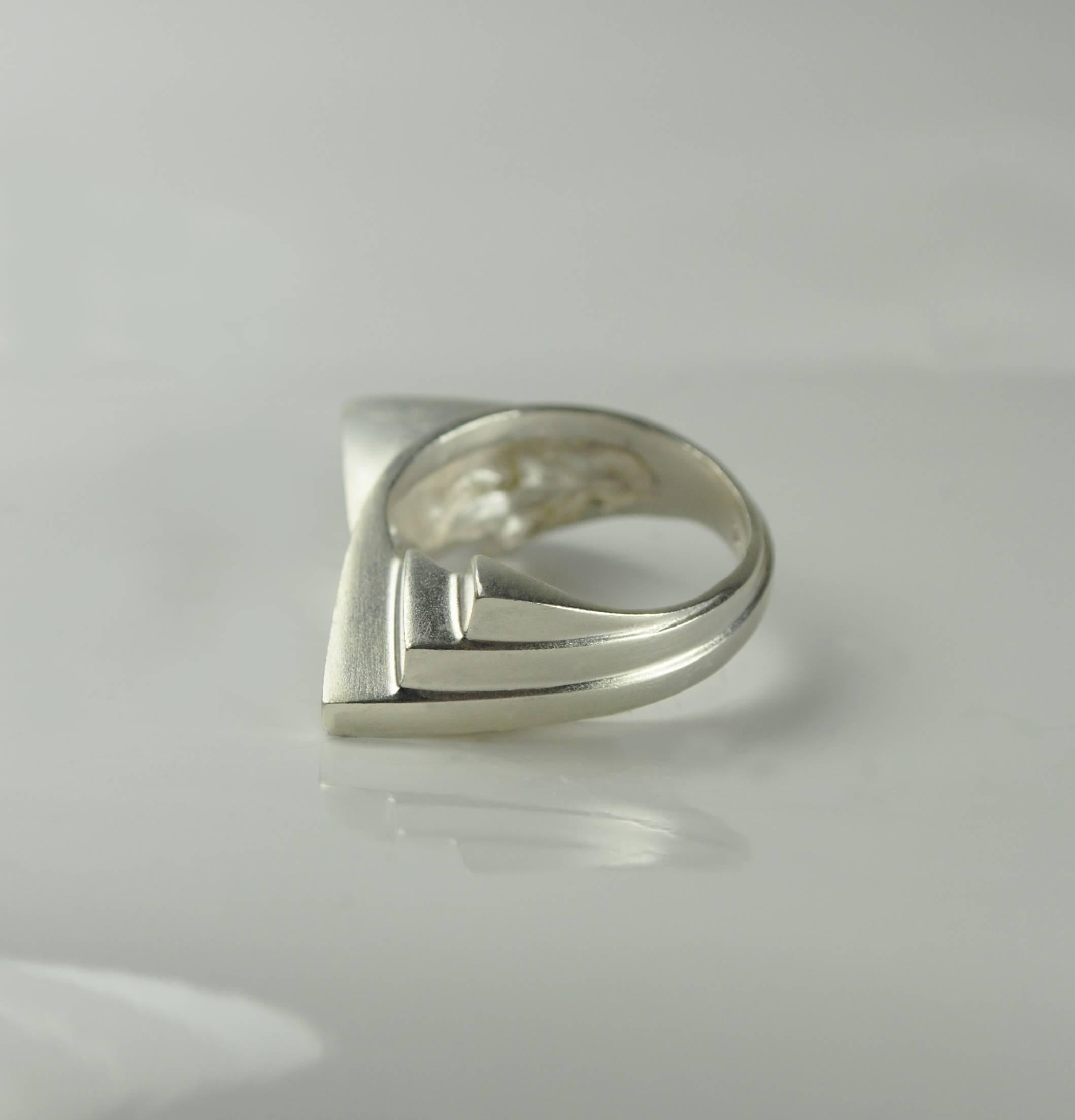The beautiful modern two sided style fan ring. Solid sterling silver, the smooth and angular steps are a signature style creating elegance and edge for the subtle or statement seeking individual.

Designed and created in Dublin, Ireland. Handling