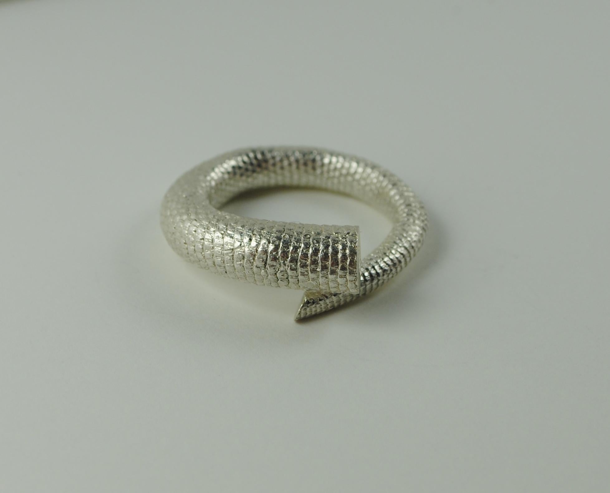 The solid rat tail ring appears as a relic on the finger. Or simply as a sculptural object.  Its organic texture originates from a ten year sculptural exploration of our fellow mammal, the rat. Cast from the actual anatomy of this species, the solid