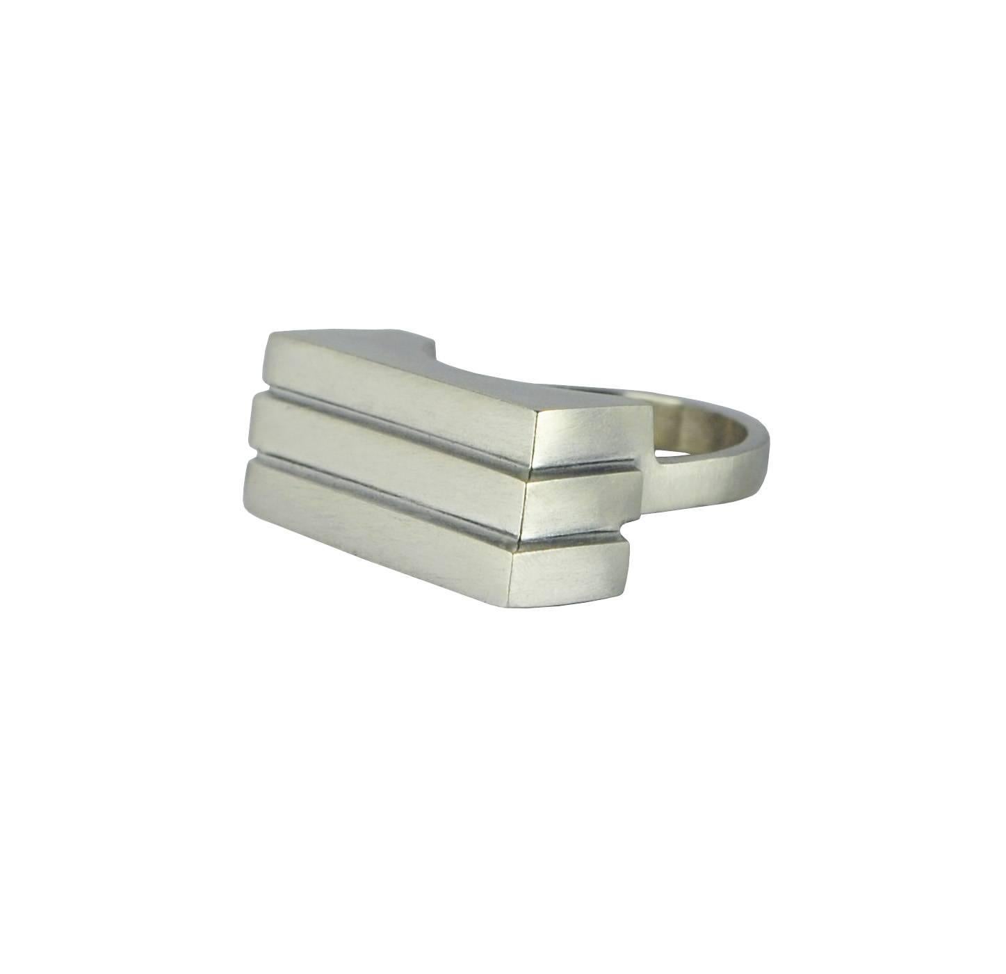 The three tiered sculptural ring is architectural by design and simplistic in appearance. 

Designed and created in Dublin, Ireland. 