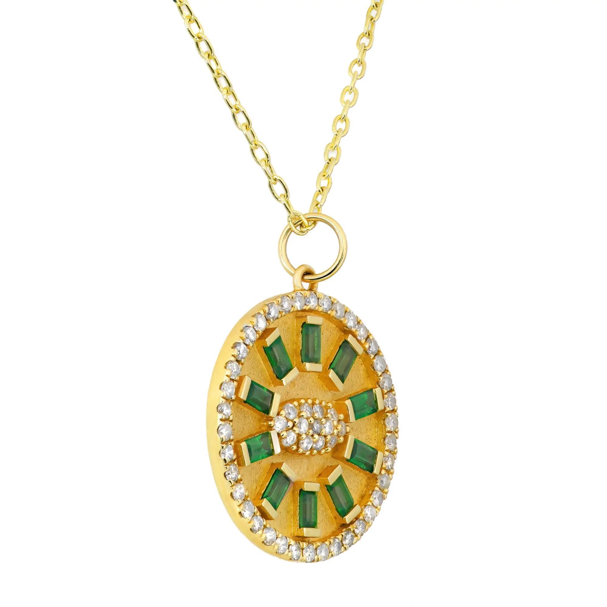 Fabulous and chic, this dazzling diamond and emerald pendant necklace is a standout addition to your everyday and evening looks. This piece gives a touch of elegance to any ensemble you pair it with. Features 10 half bezel set baguette cut emeralds