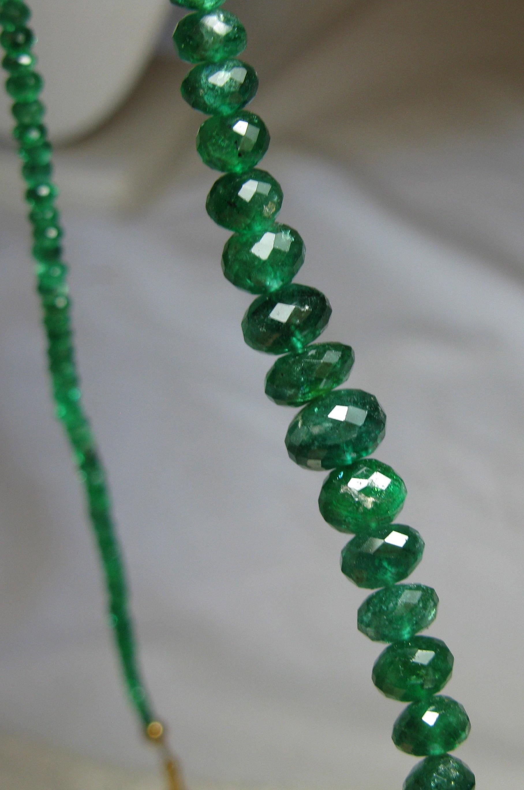 Sparkling Natural Mined Emeralds in faceted graduated beads create this stunning necklace.  The Emerald Necklace is 18 inches long and has a 14 Karat Gold Clasp.   Provenance:  From the estate of New York socialite and style setter Anne Lichtblau