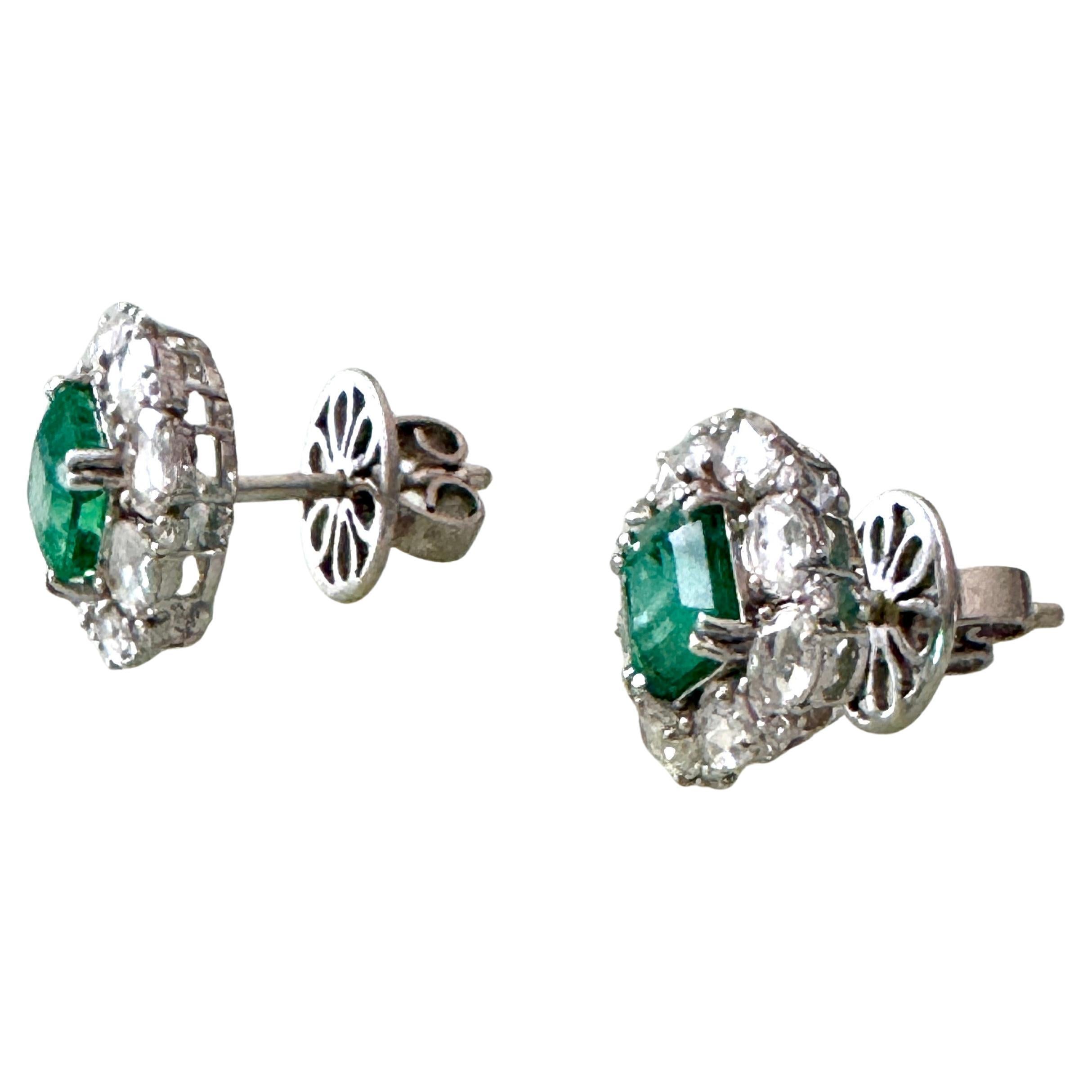 Emerald 18K White Gold Dimond Stud Earrings
Handcrafted elegant Colombian Emerald about 2.17 Carat surrounded with 8 oval natural VS quality diamond about 1.39 Carat mounted in 18K White Gold. Total weight 4.8 grams, and about 0.5 inch wide.