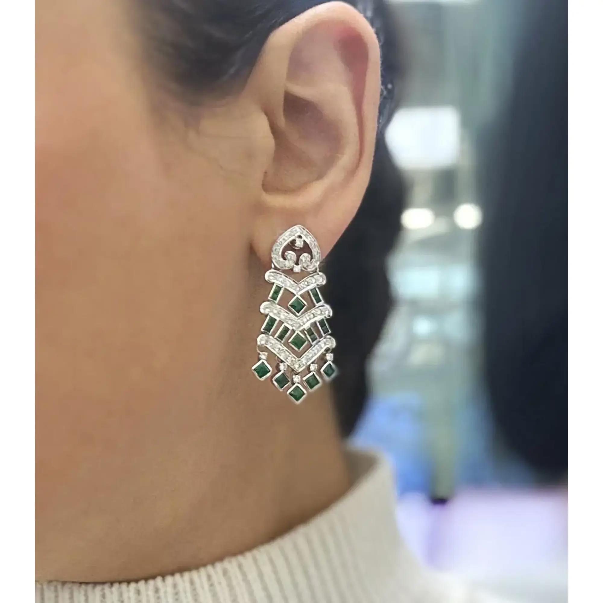 Showcasing these beautiful chandelier drop earrings, crafted in 14k white gold. These earrings feature bezel set square cut emeralds weighing 2.25 carats with pave set round cut diamonds weighing 1.35 carats. Diamond quality: color H-I and clarity