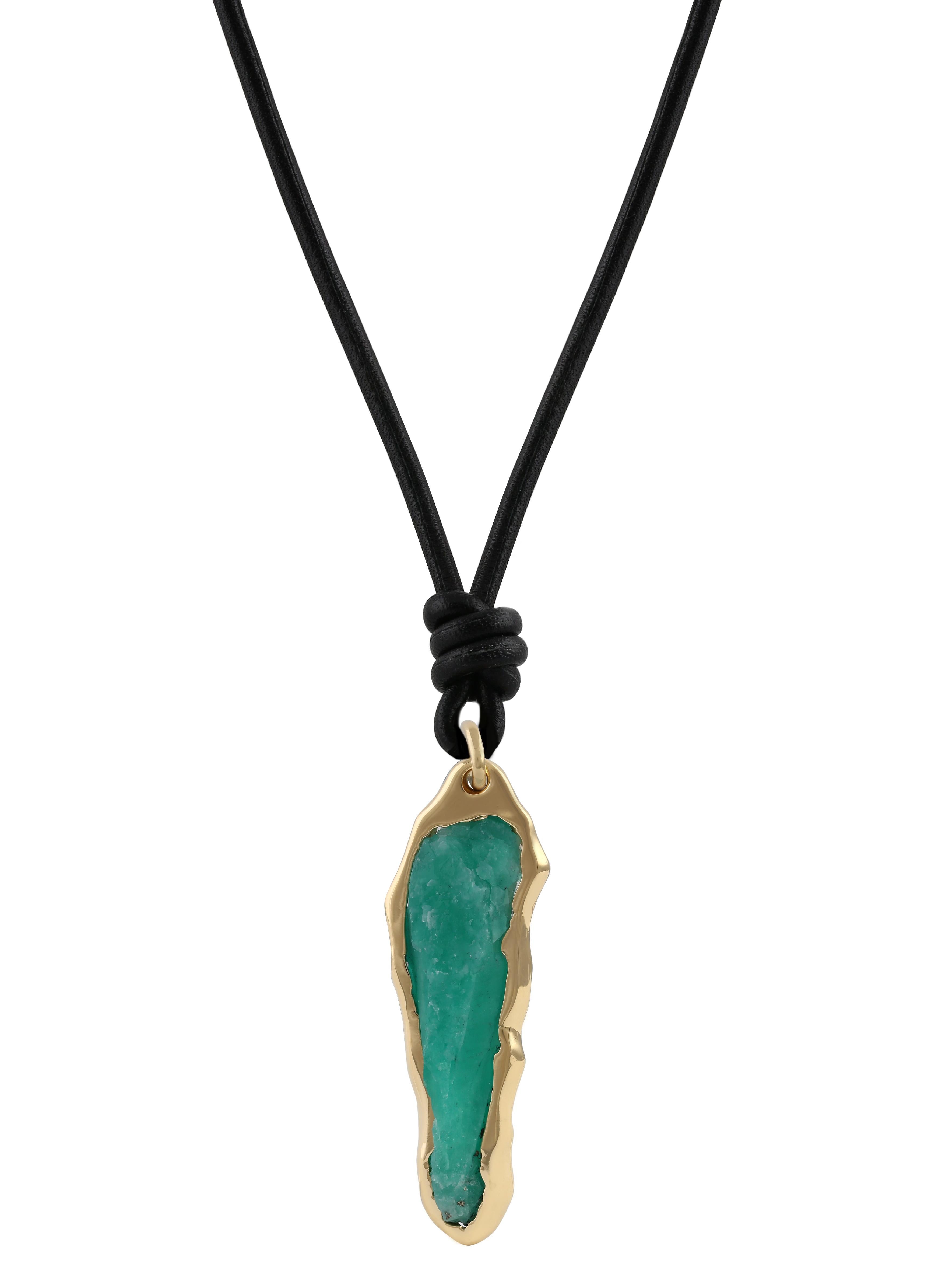 A collection of magnificent rough emeralds from Columbia, set within a subtle melted bezel setting, allowing the full beauty of the stone to be appreciated from nearly all angles. The yellow gold colour compliments the green of the emerald, making