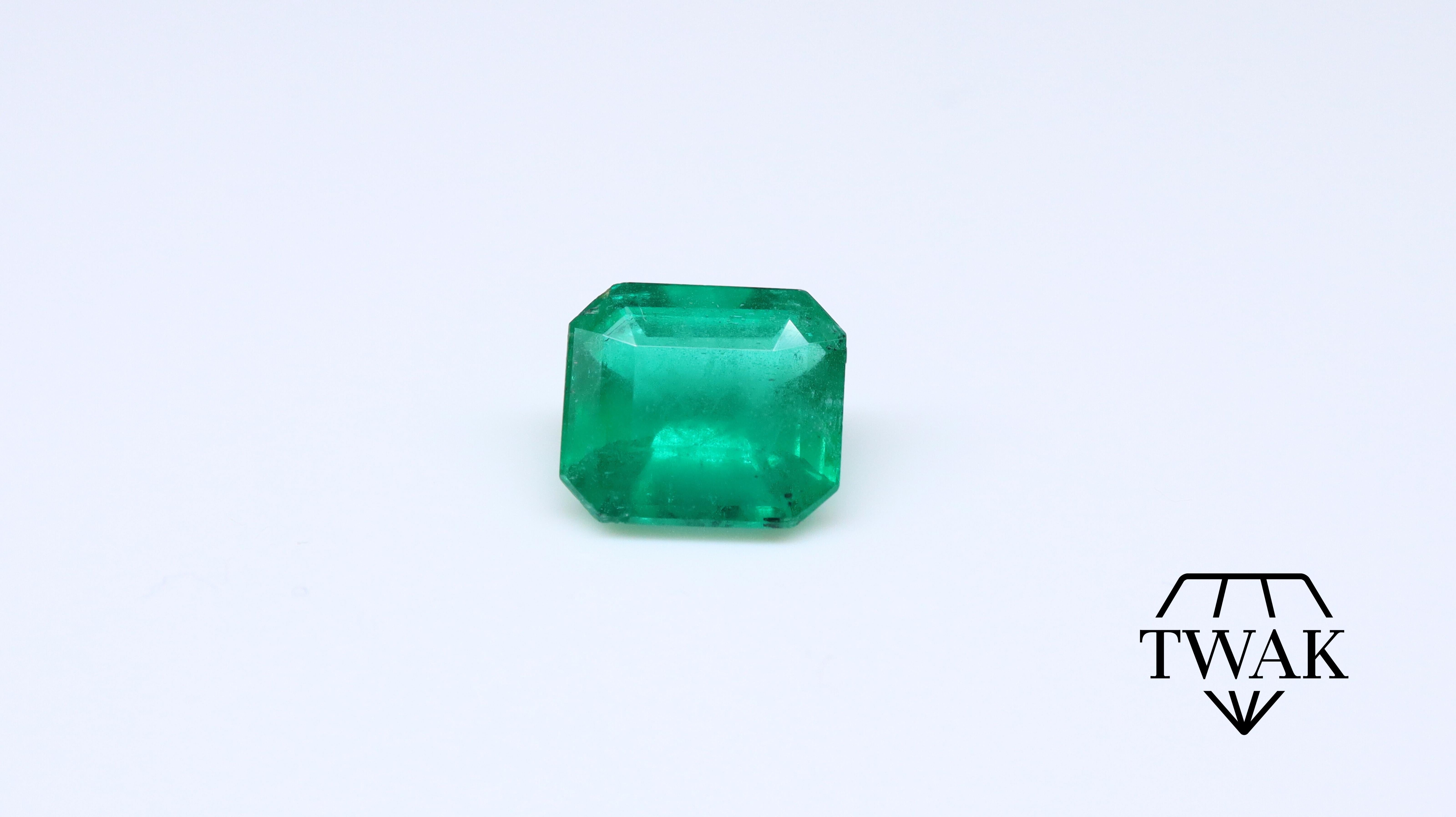 A beautiful Emerald with excellent color, crystal, and saturation.

Details and description:
Dimensions: 7.31 x 8.36 x 4.58mm
Weight: 1.89ct
Color: Vivid Green 
Treatment: Opticom

Emeralds are naturally porous and inclusive stones, with surface