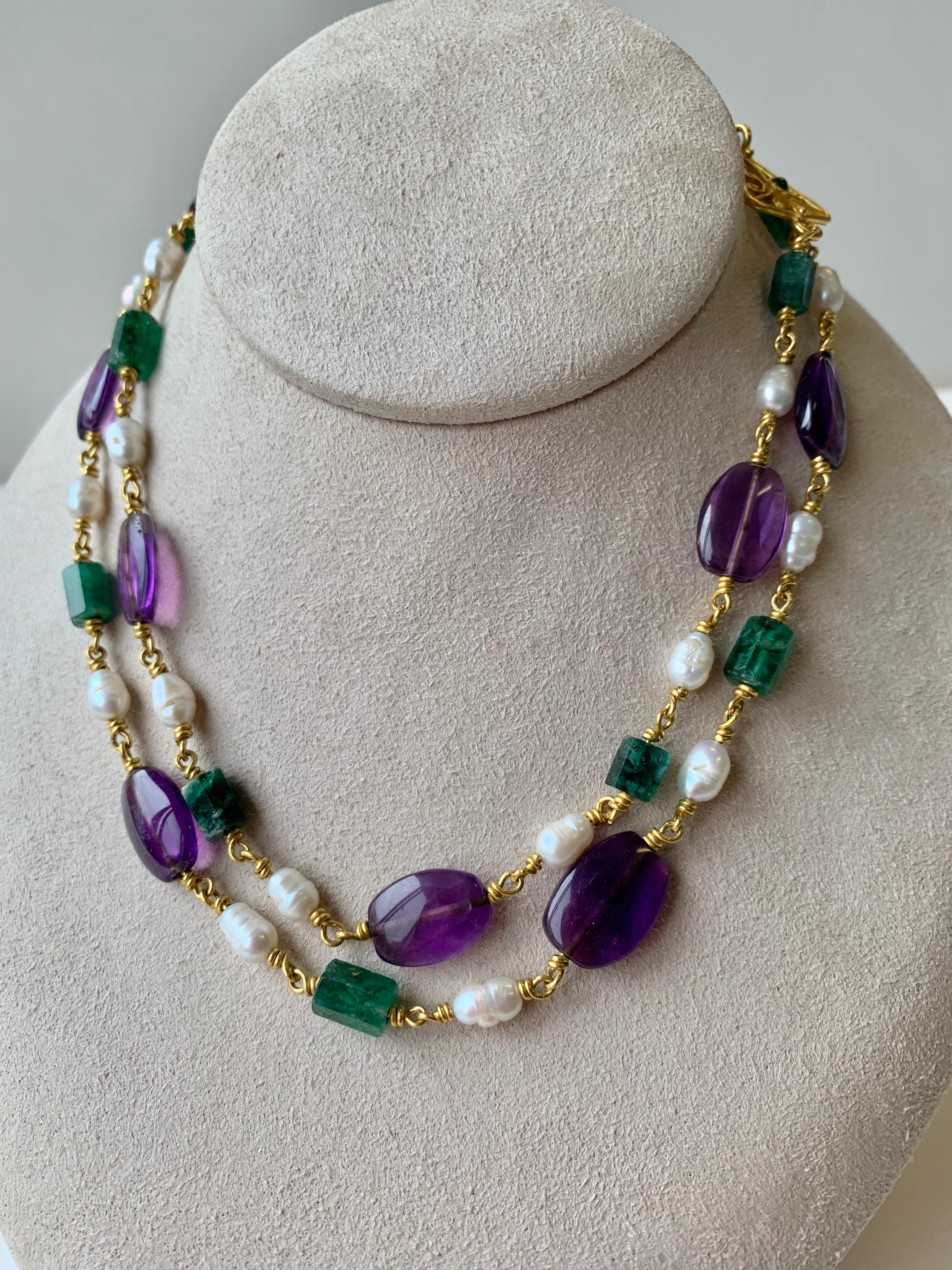 22 Karat gold necklace of Amethyst, emerald crystals and fresh water pearls in the manner of Roman 3rd century pieces. 
The neclace measures 32 inches, with  11 Emeralds weighing approximately 40 carats, 11 amethysts, the clasp is Amethyst and