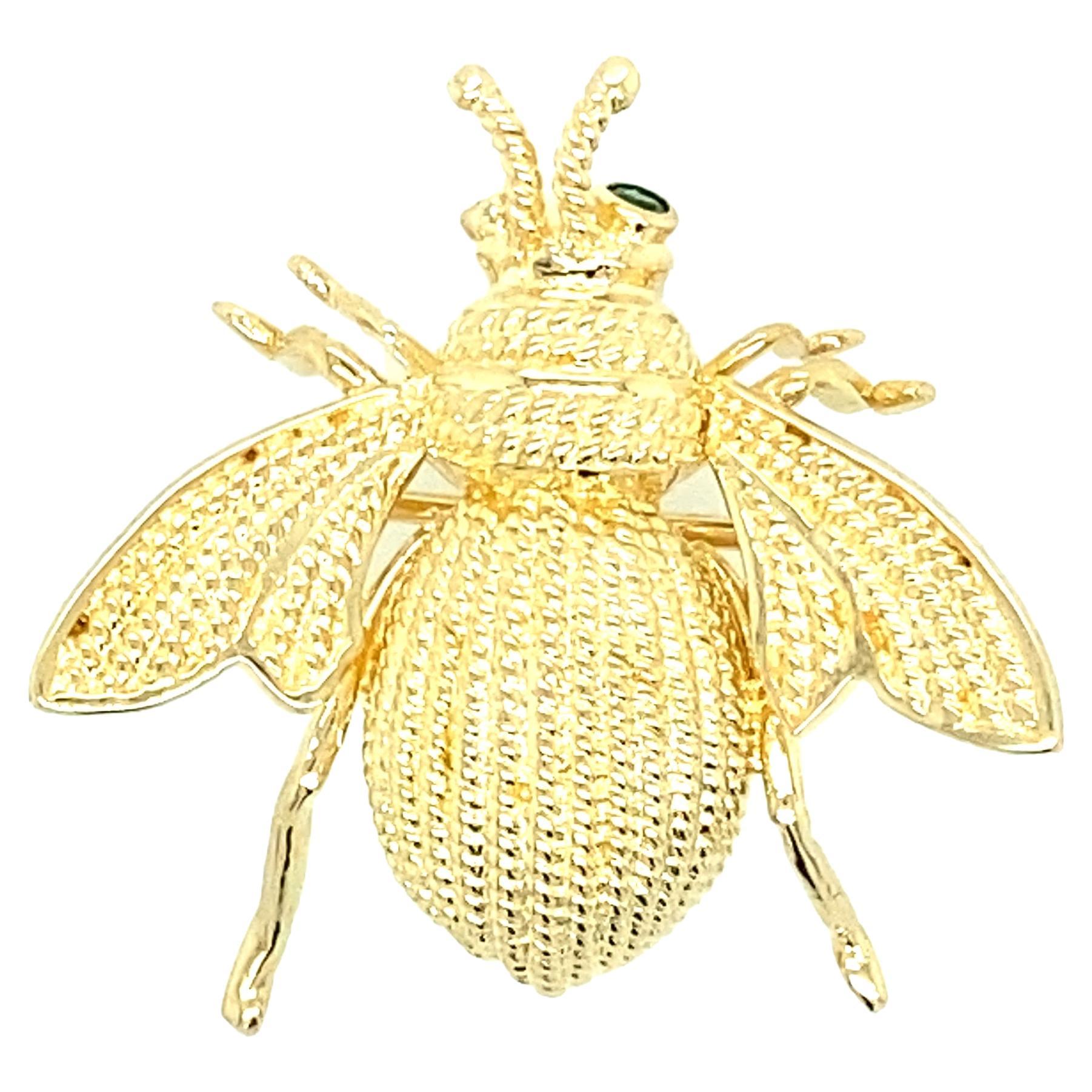 Modern Emerald and 14 Karat Gold Fly Design Pin. 1970s.