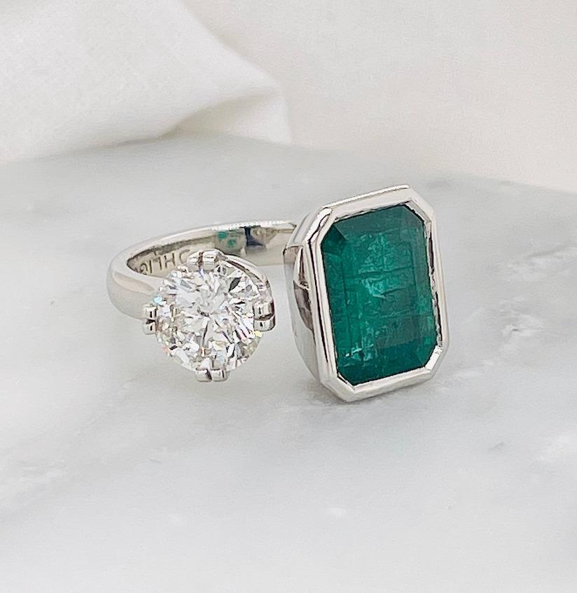 Custom made order**

Please contact our design to start the stone selection process 

3ct Emerald paired with a 1ct GSI white diamond ( we can offer any clarity and colour to suit other price points)

Small white diamond set under the setting in