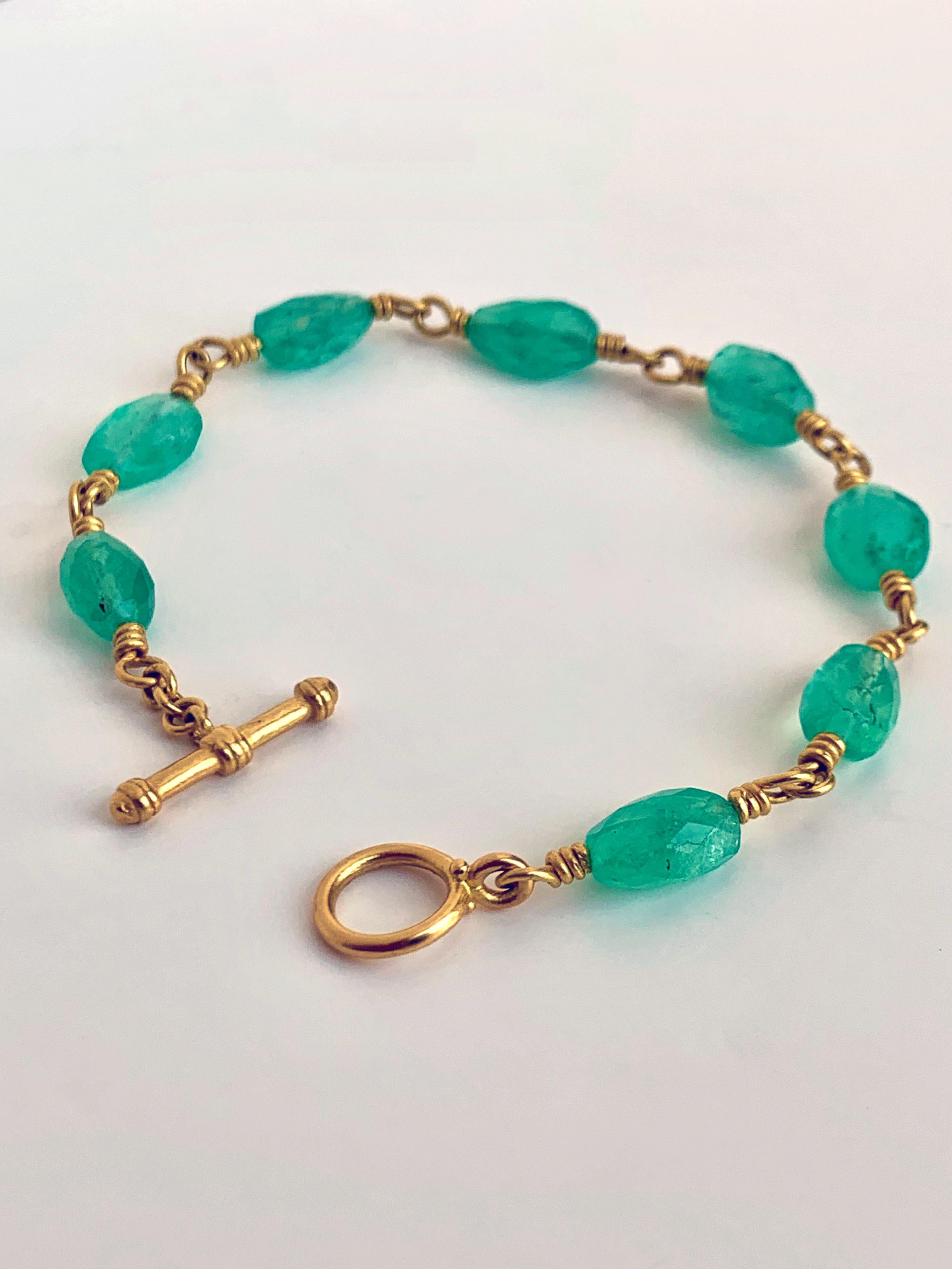 Emerald's history with man dates back more than 3000 years. They were worn by Cleopatra. Shah Jahan who built the Taj Mahal, inscribed ancient texts into the stones and wore them as talismans. This bracelet carries 29 carats of emeralds and linked