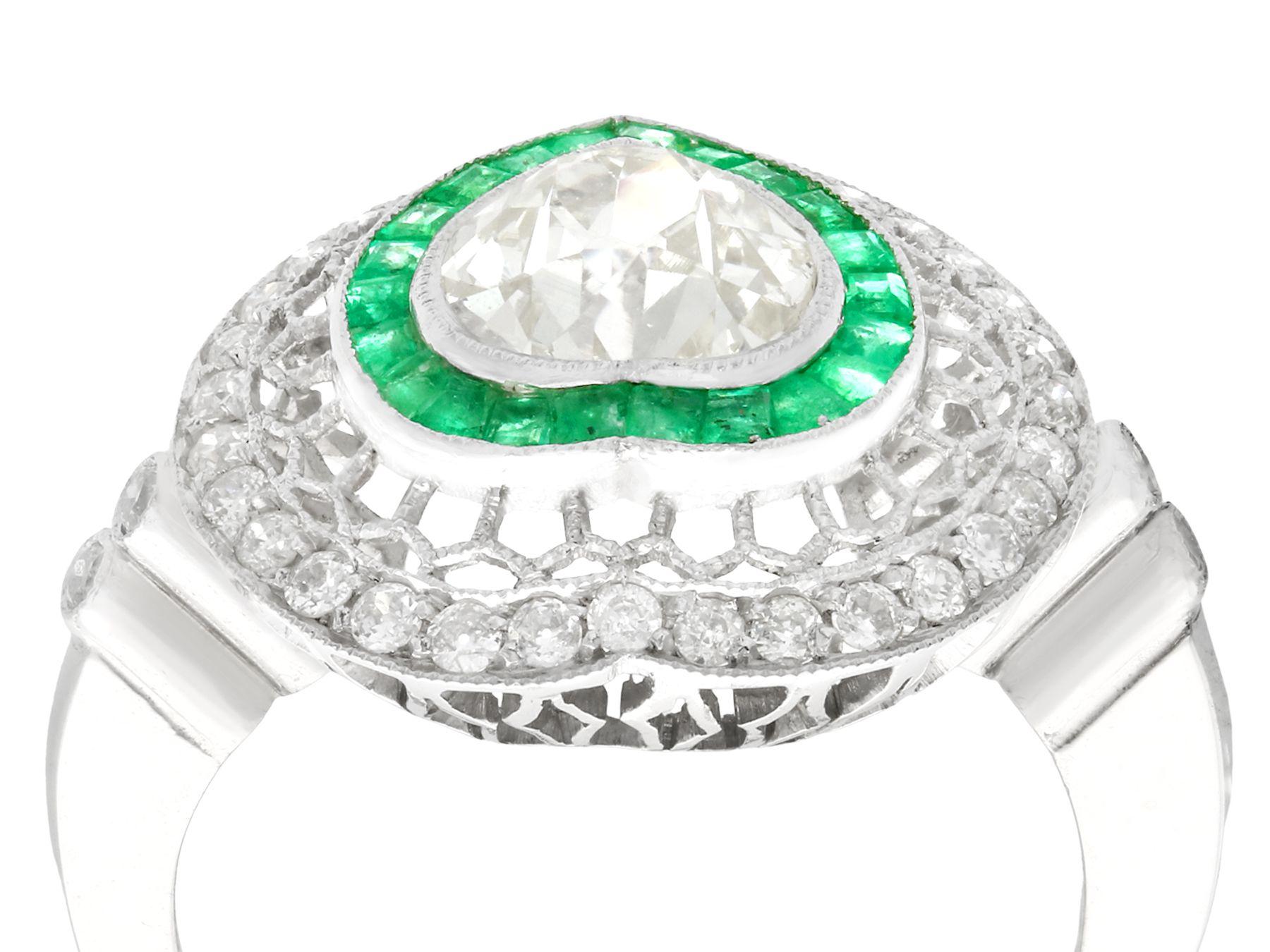 A stunning antique and contemporary 0.68 carat emerald and 2.62 carat diamond, platinum cocktail ring; part of our diverse emerald jewellery and estate jewelry collections.

This stunning, fine and impressive emerald and diamond ring has been