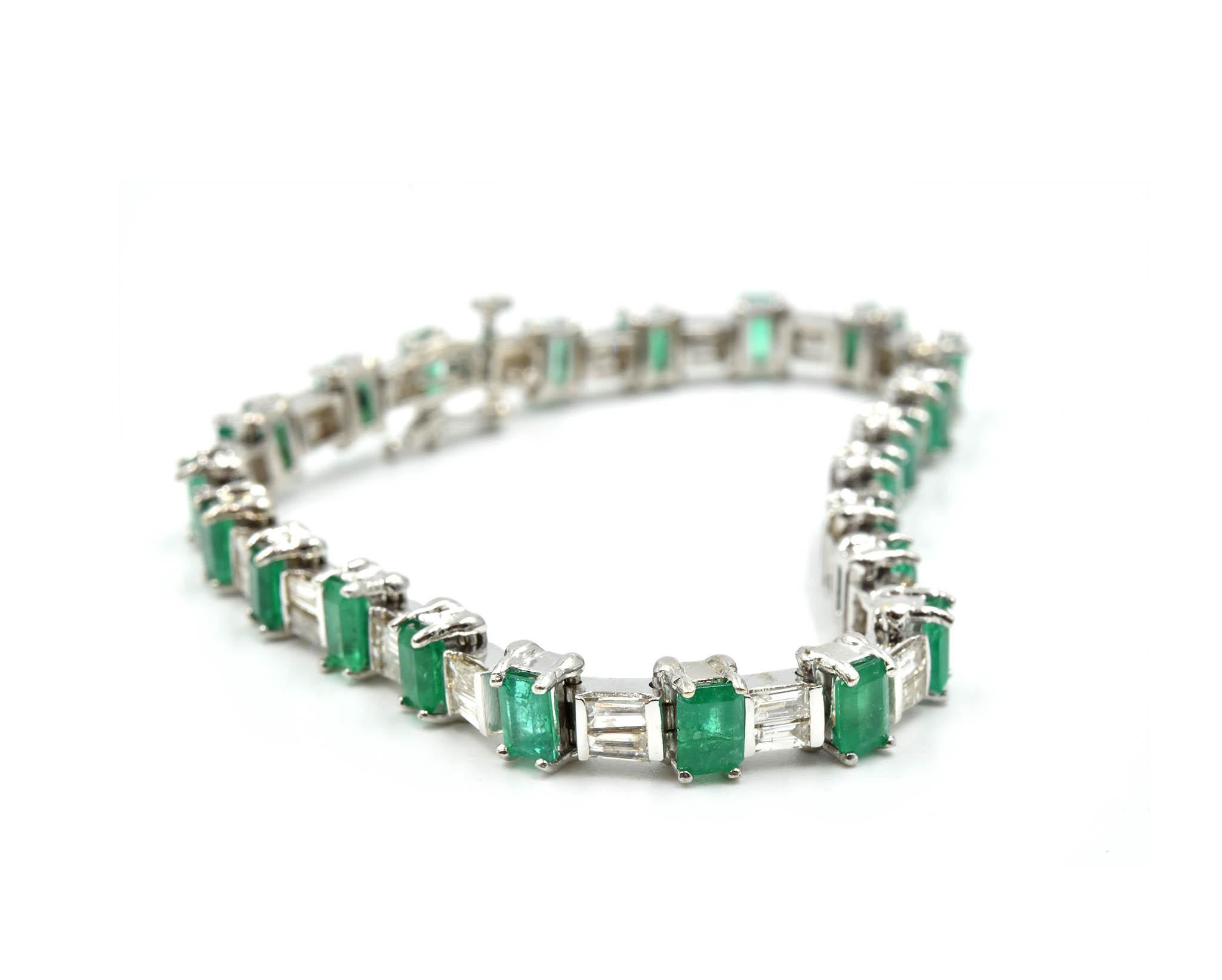 Designer: custom design
Material: 14k white gold
Emeralds: 22 emeralds = 7.70 carat total weight
Diamonds: 44 baguette cuts = 1.32 carat total weight
Dimensions: the bracelet measures 7-inches long and 1/4-inches wide
Weight: 20.08 grams
