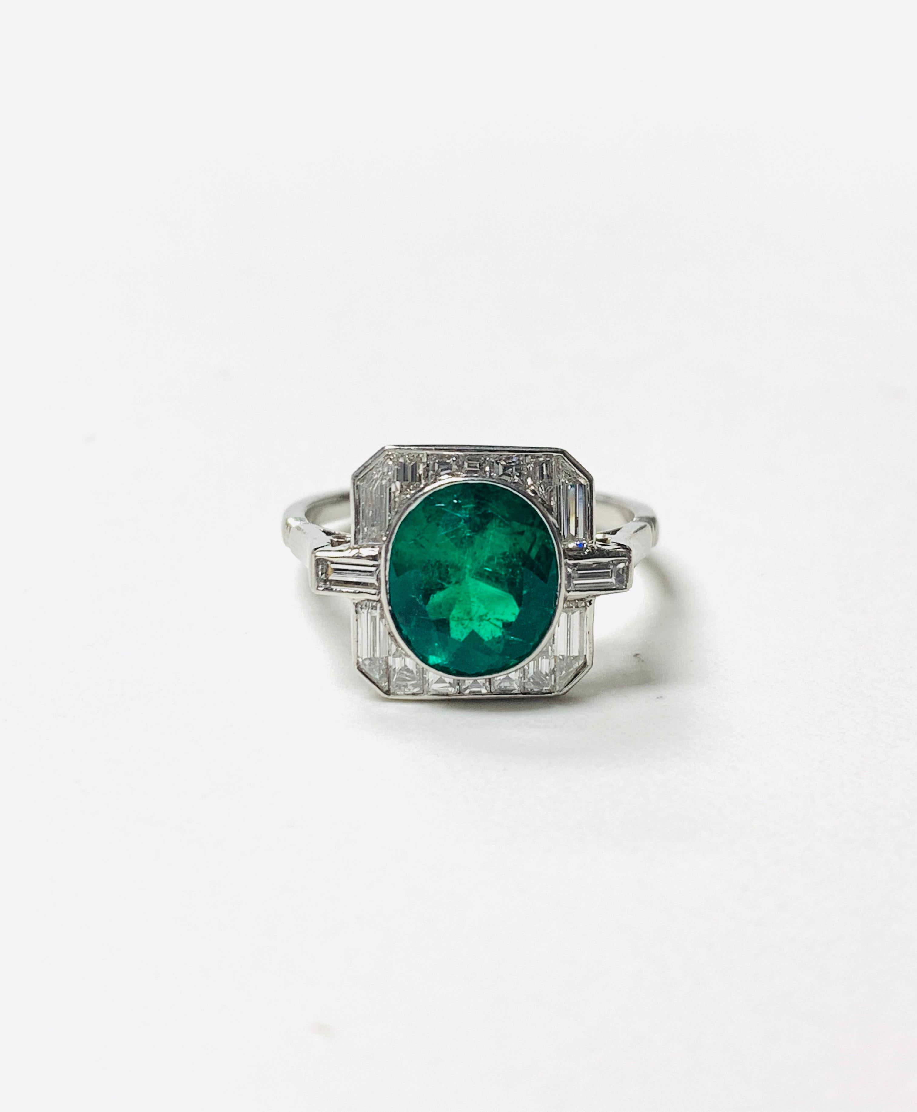 This gorgeous emerald and diamond engagement ring is handmade in platinum. 
The details are as follows: 
Emerald weight : 1.90 carat ( Zambia origin )
Diamond weight : 1 carat ( GH color and VS clarity ) 
Metal : Platinum 
Ring size : 6 1/4
