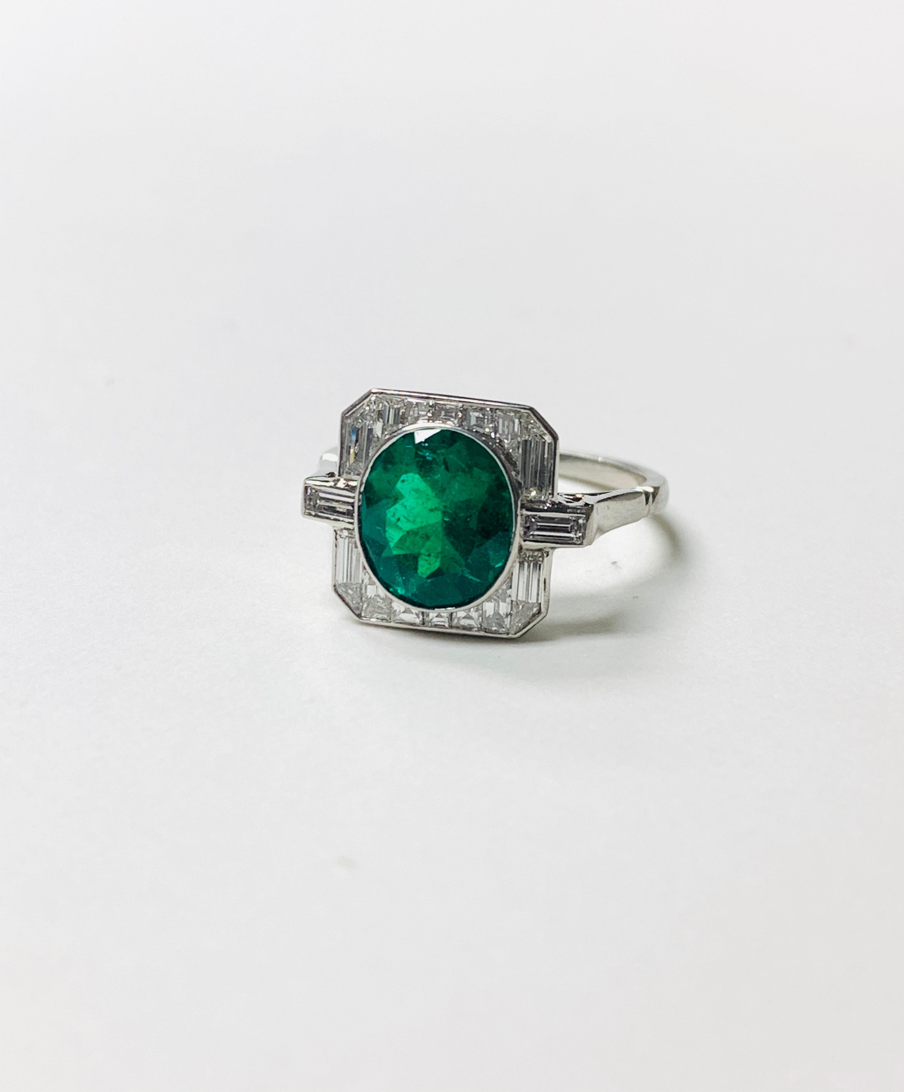 Contemporary Emerald and Baguette Diamond Engagement Ring in Platinum