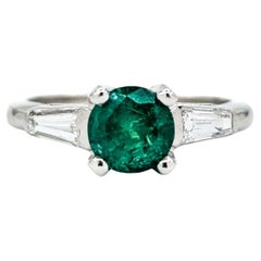 Anillo de Esmeralda y Diamante Baguette en Platino