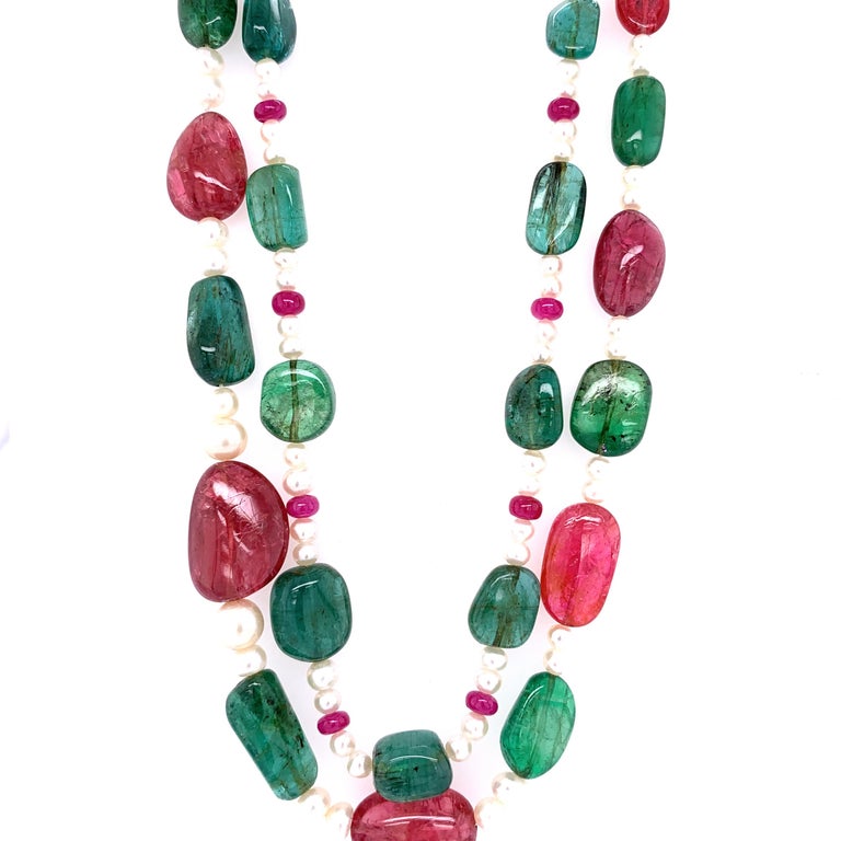 Emerald and Burmese No Heat Red Spinel Beads Brown Diamond Gold Necklace:

An elegant necklace, it features beautiful emerald beads weighing 135.45 carat, Burmese no heat red spinel beads weighing 127.96 carat, a stunning brown diamond white gold