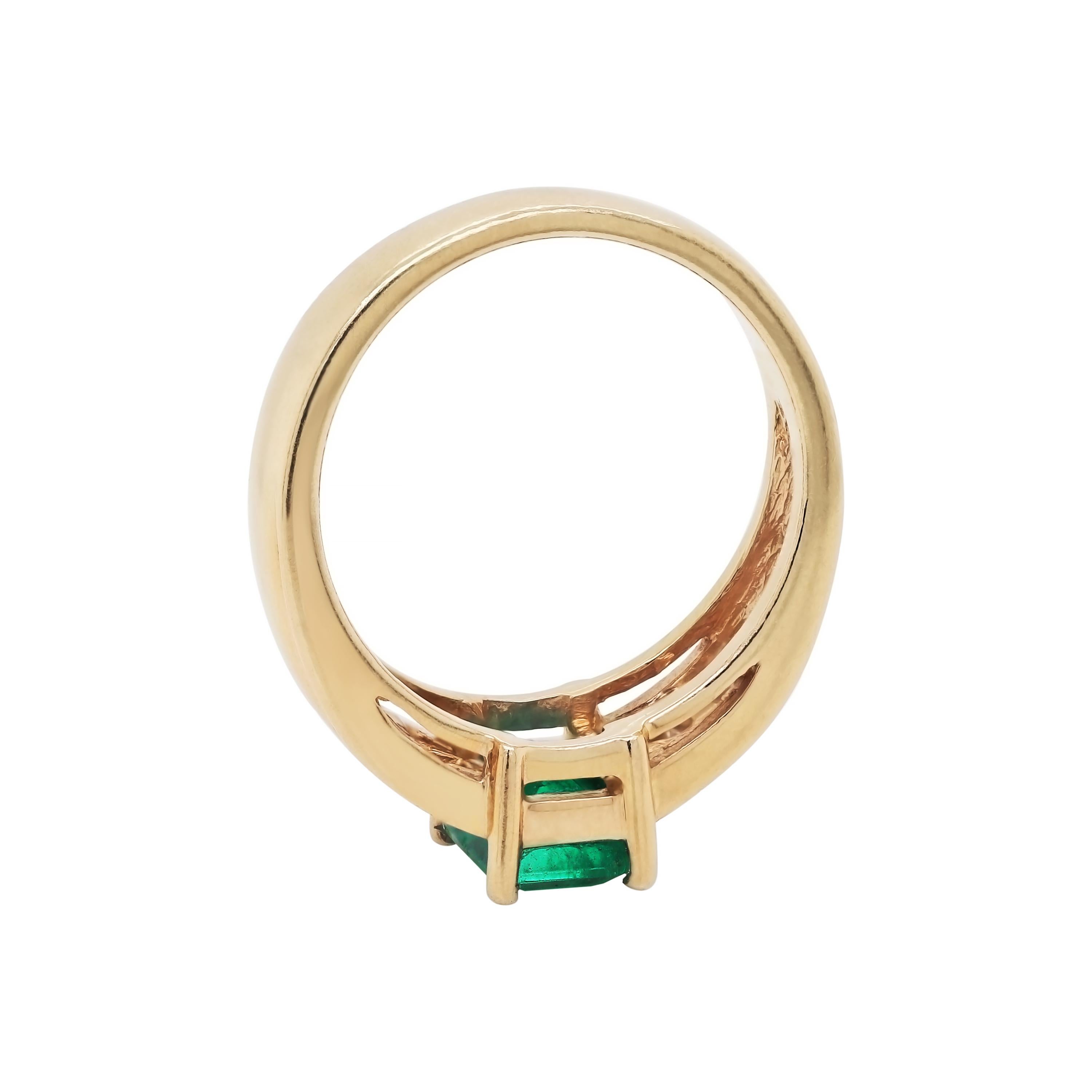 Modern Emerald and Diamond 14 Carat Yellow Gold Ring For Sale