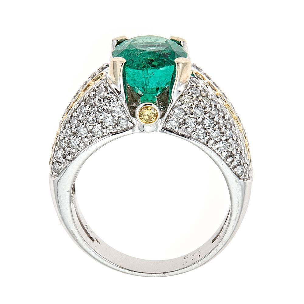 3.2 Carat Emerald and Diamond Engagement Ring 14 Karat White Gold Jewelry Size 7

Fashioned in sleek 14k white gold, this ring represents glamour and style. Oval shaped emerald of 3.2 TCw is s surrounded by rows of canary yellow and white diamonds,
