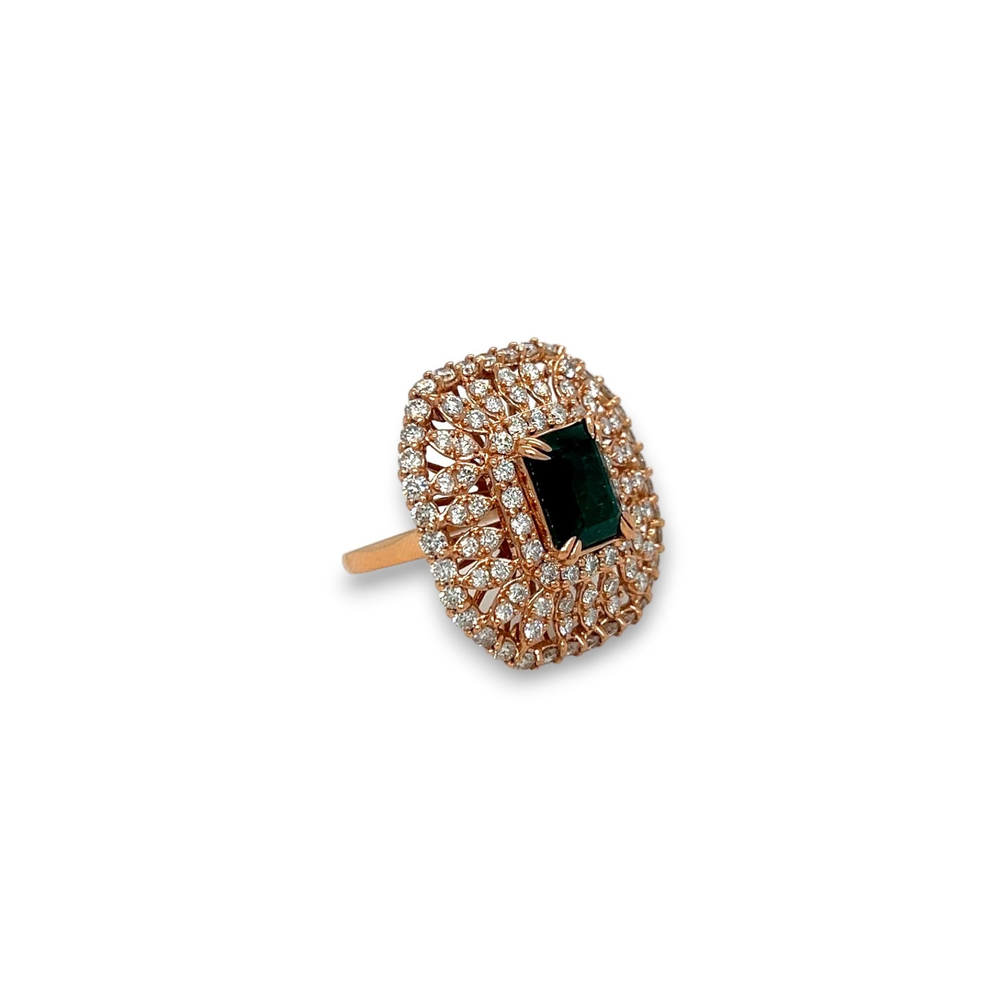 Add a touch of elegance to your wardrobe with this stunning cocktail ring. Crafted from 14k rose gold, this ring features a beautiful 2.54 ct emerald-cut emerald center stone. The emerald is complemented by the round-cut diamonds (approximately 2.09