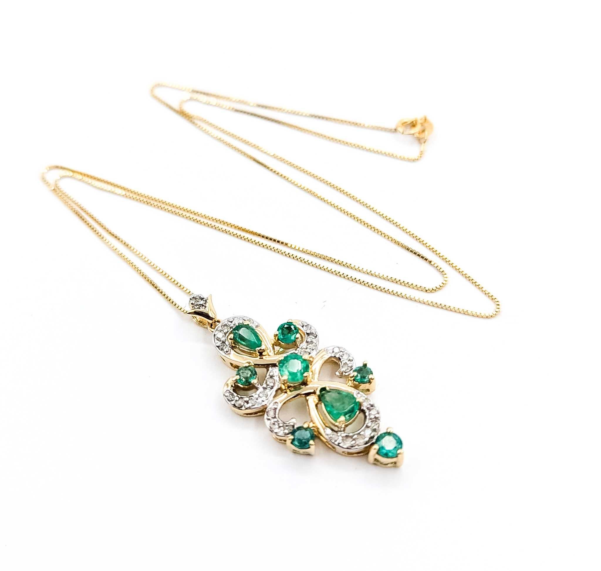 Emerald and Diamond 14k Yellow Gold Pendant

Introducing this exquisite emerald pendant with chain, crafted in 14k yellow gold with an elegant Fleur De Lis design. This pendant features a stunning combination of gemstones, including a magnificent