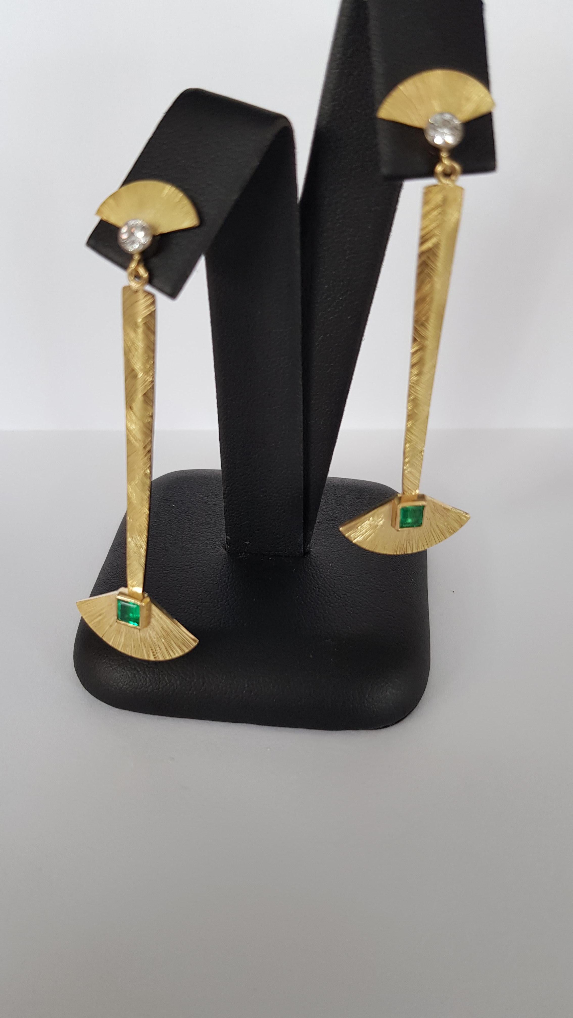Very dramatic 18CT gold drop earrings in a nod to Egyptian style with Colombian emeralds and Diamonds ,hand fabricated and pattern applied
Diamonds FVVS 0.30CT Emeralds approx 0.65CT

.