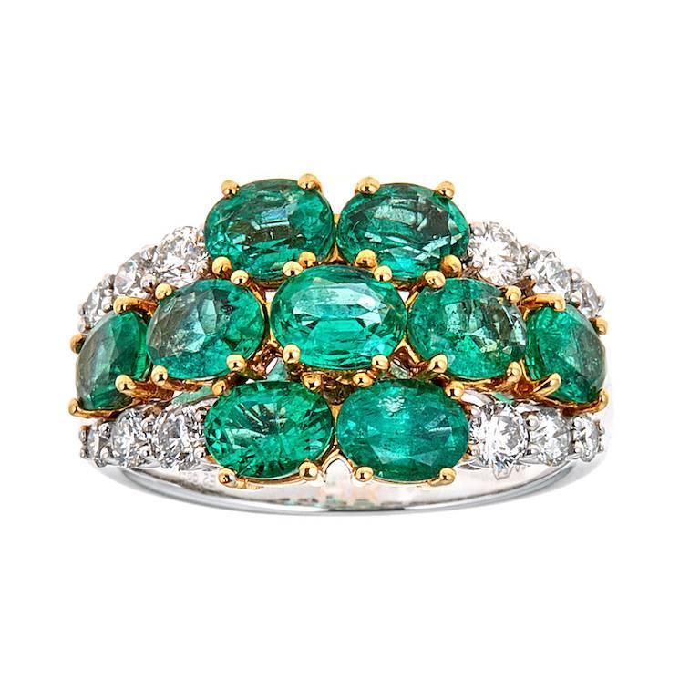 18 Karat Gold 2.99 Carat Emerald and Diamond Cluster Ring Designer Fine Jewelry

A glamorous addition to your jewelry collection. Accents high-quality diamonds hug and embrace oval-shaped vivid green emeralds, creating mesmerizing flower design. Set