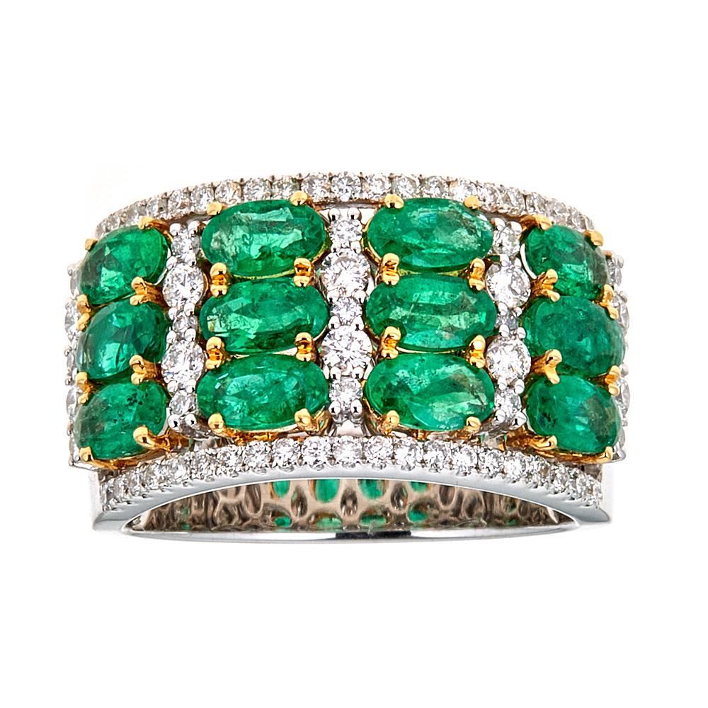 2.69 Carat Emerald and 0.68 Carat Diamond 18 Karat Tow-Tone Gold Ring Jewelry

Glamorous look. The set of oval-shaped emeralds are set in three-stone horizontal rows in a prong setting. Diamonds are layered around the emeralds, creating a wide